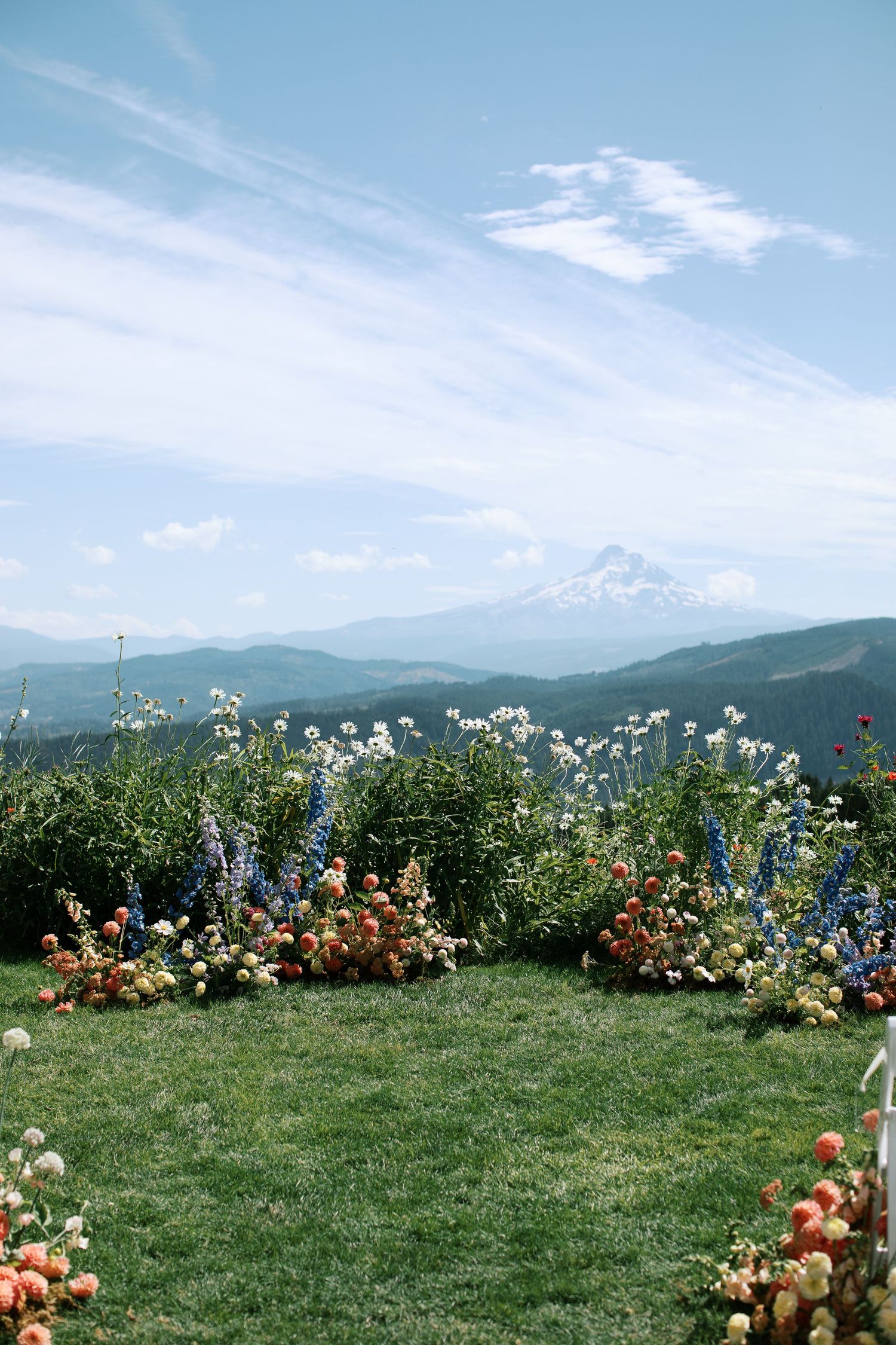 35mm film shot of mountain hood with colorful floral arrangements and a blue sky-Adrianna Elizabeth Photography.