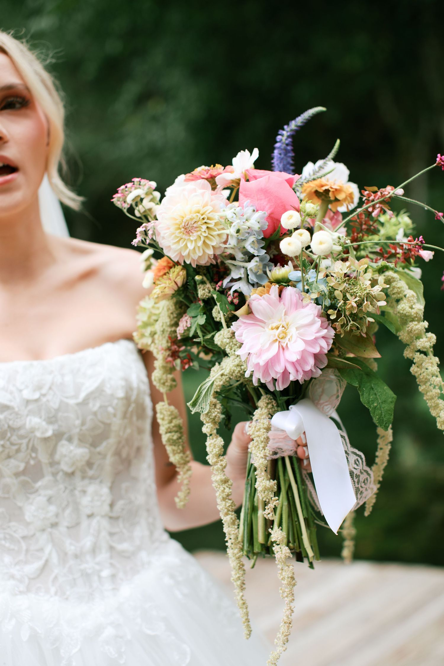 Elegant bridal bouquet featuring pink dahlias, lavender, and cascading greenery - Adrianna Elizabeth Photography.