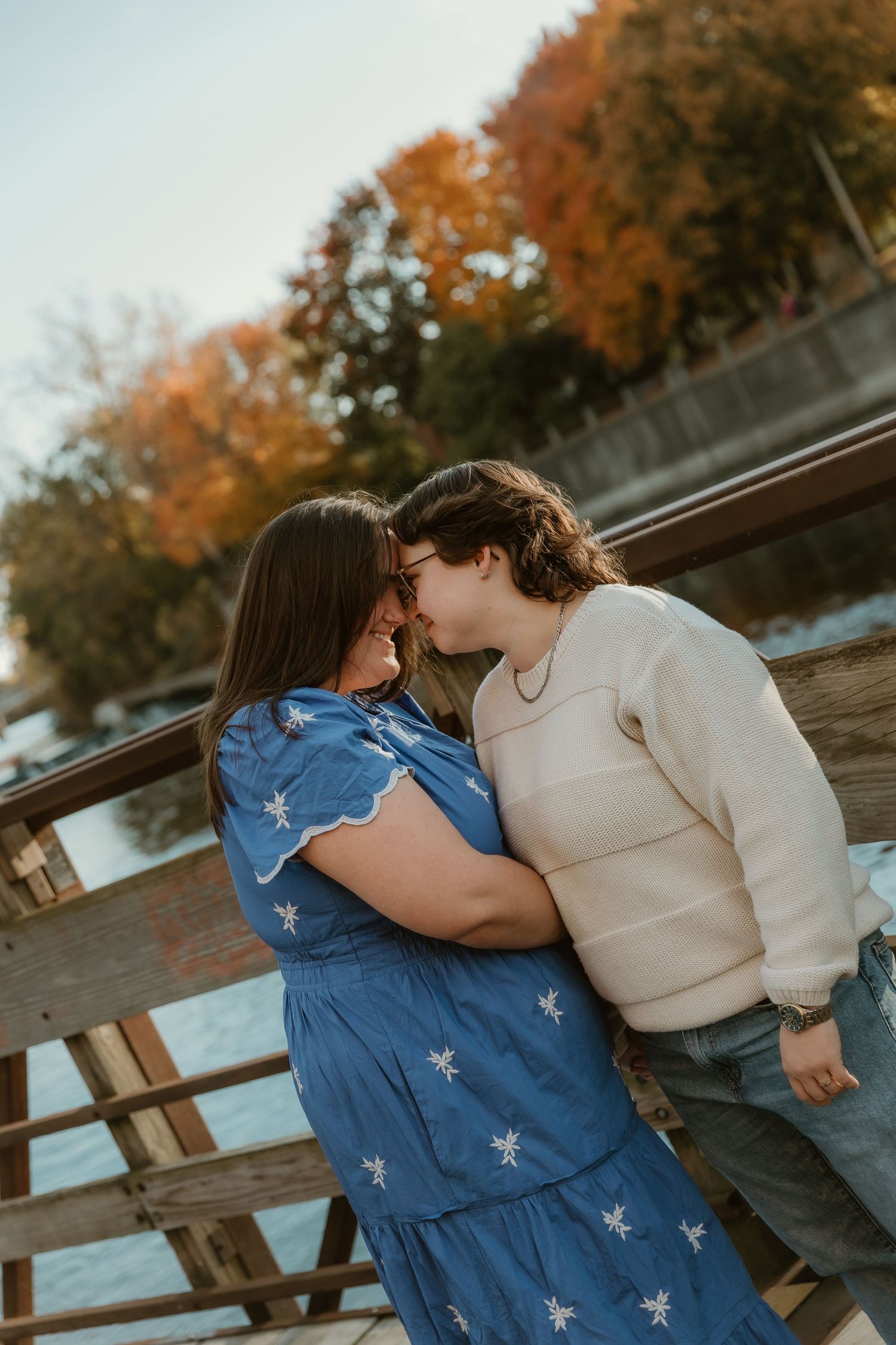 Couple shares an intimate moment with each other during their engagement session in downtown lansing, MI with engagement photographer