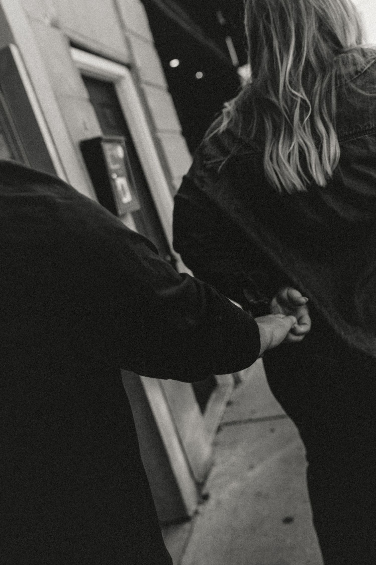 Future Bride pulls Future Groom toward their next location and illinois wedding photographer captures how their hands hold one anothers