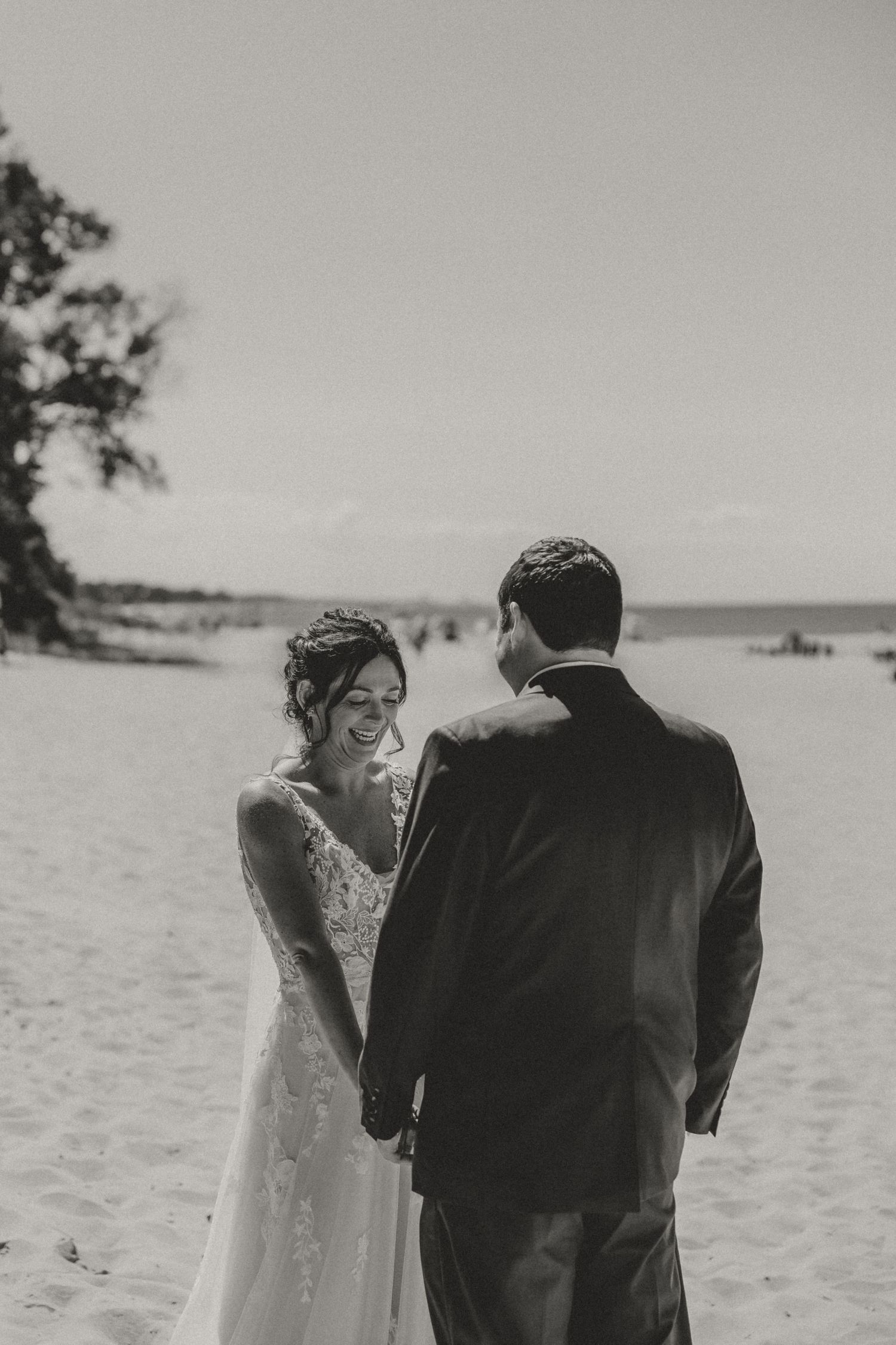 Bride and Groom share their first look and private vows at Town Line Beach in Union Pier, MI captured by illinois wedding photographer