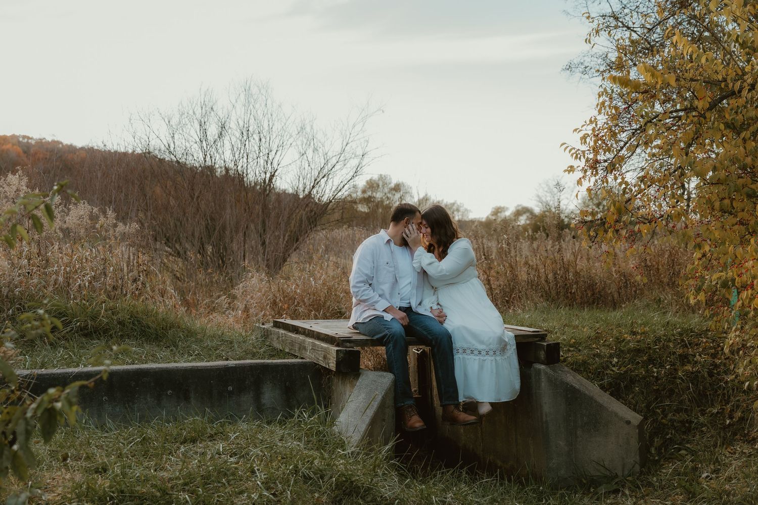 Couple shares an intimate moment with each other while central illinois wedding photographer documents their engagement
