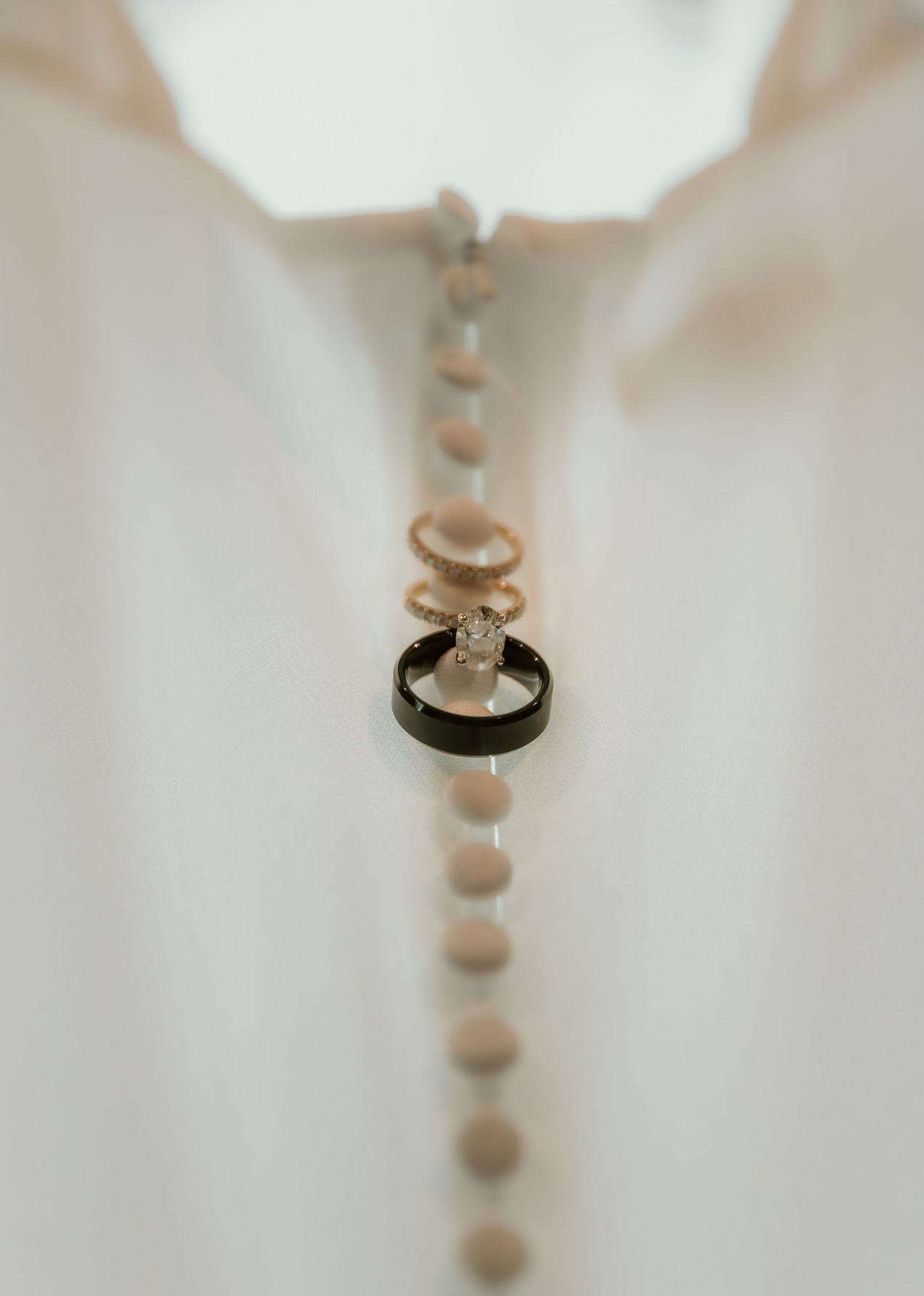 Ring detail shot captured on back of wedding dress by illinois wedding photographer during getting ready wedding portraits