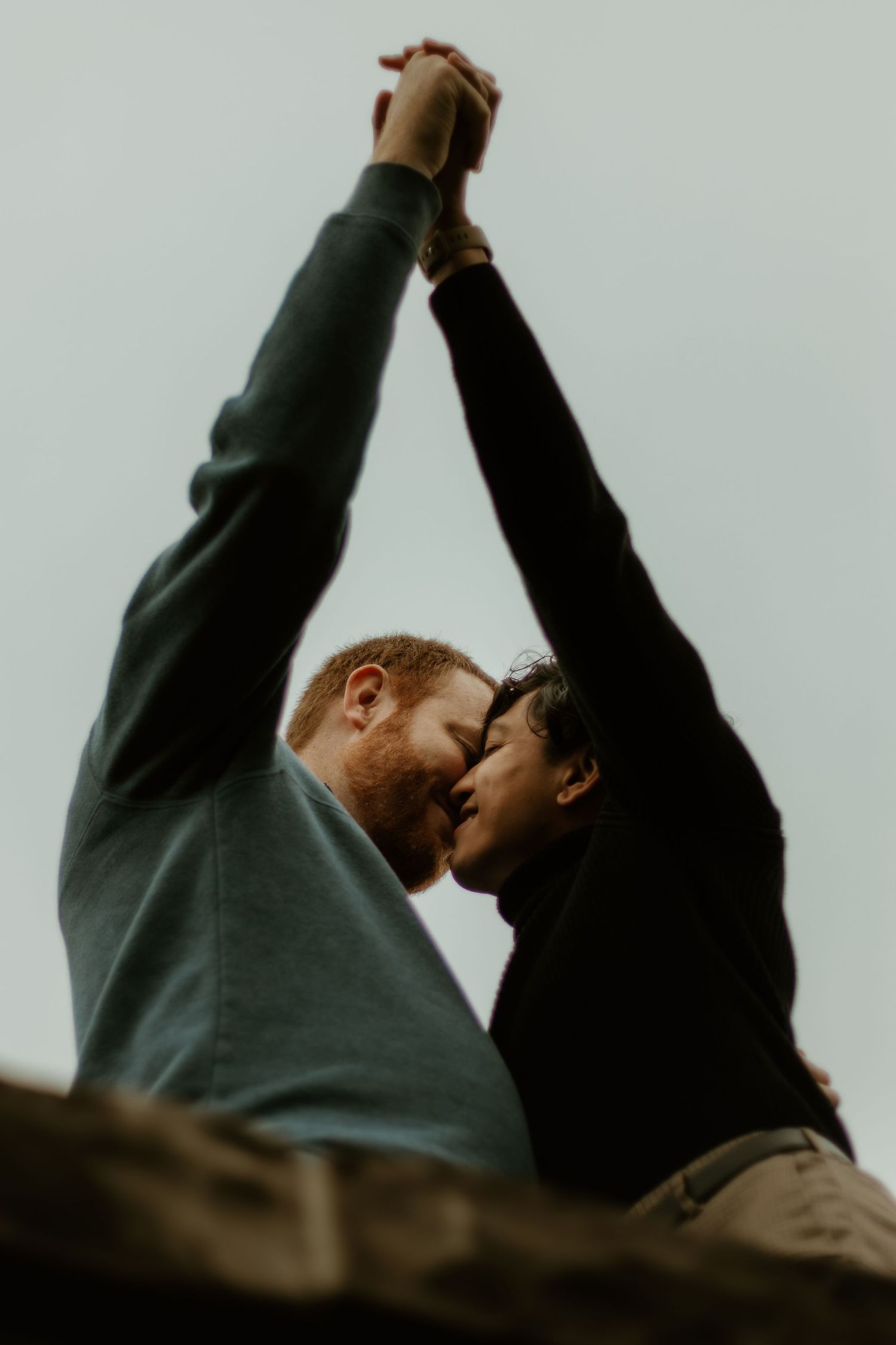 lgbtq+ couple share intimate moment while posing for central illinois couples photographer