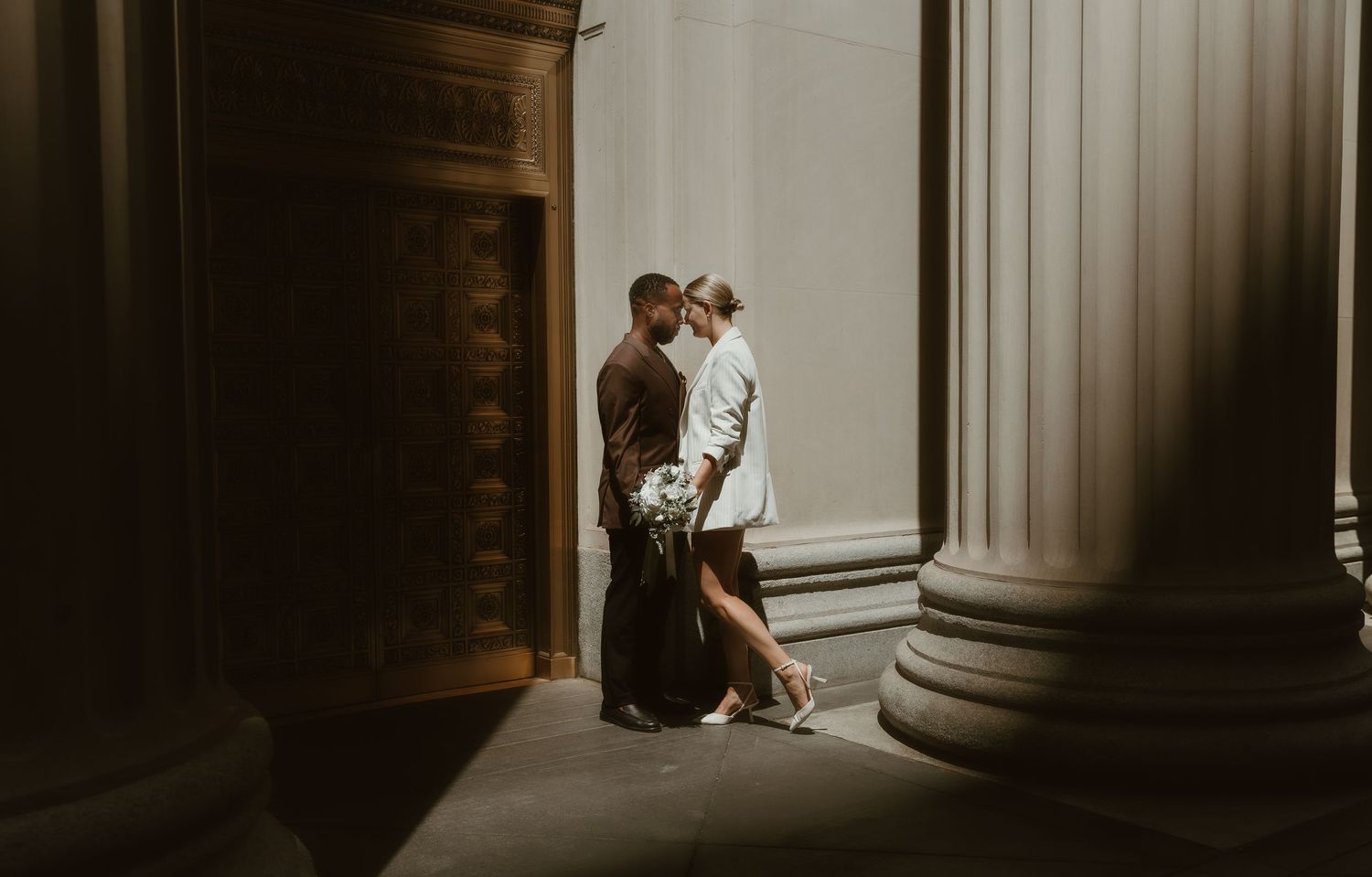 Sehl Photography Chicago IL photographer captures a romantic doorway portrait—architectural drama, floral softness, and timeless elegant