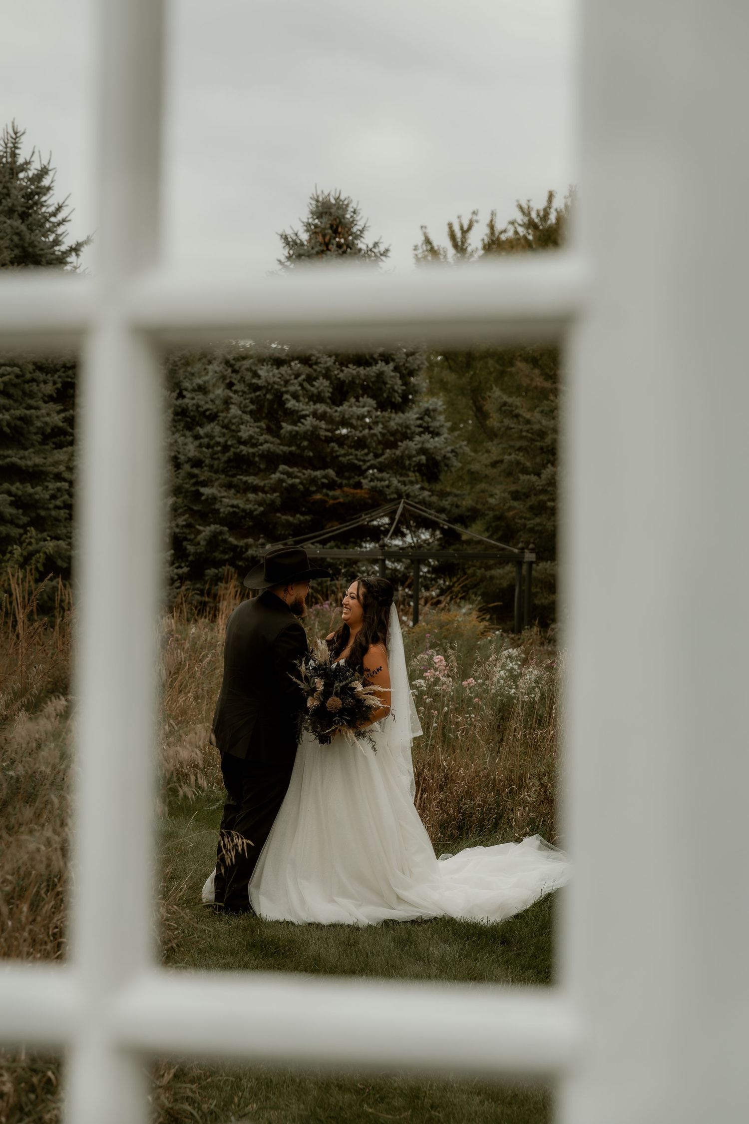 Bride and Groom share an intimate moment during during wedding portraits with central illinois wedding photographer