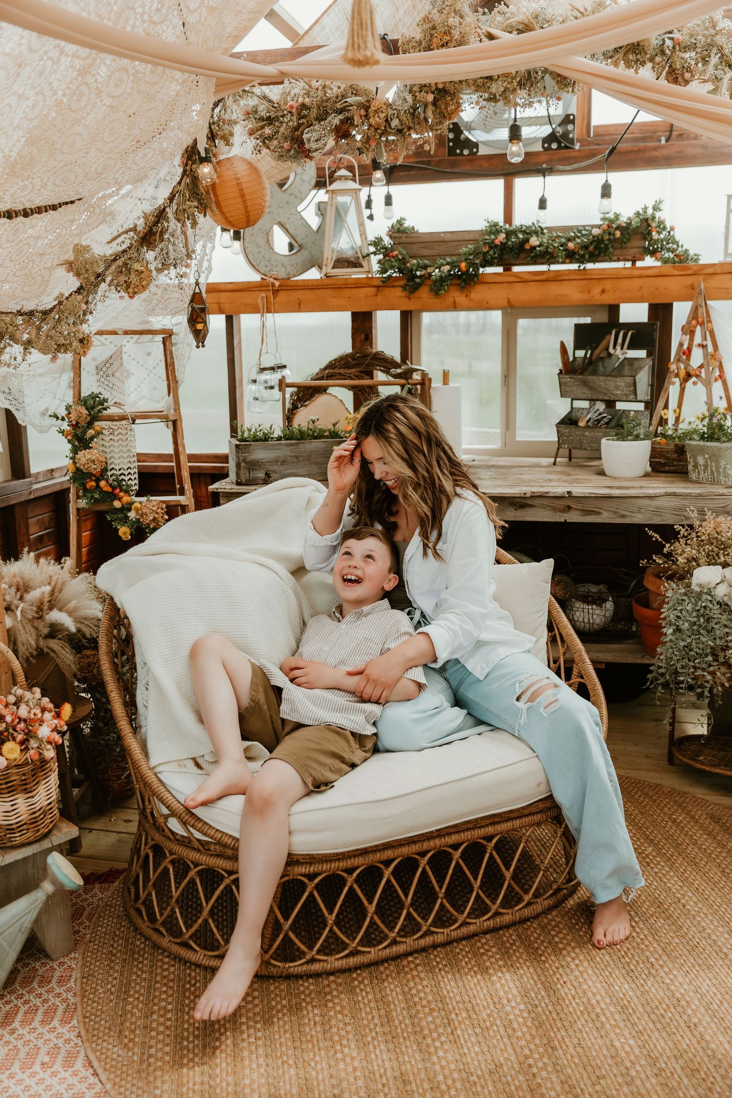 Mom cuddles her baby during a fun moment captured by bloomington normal il family photographer