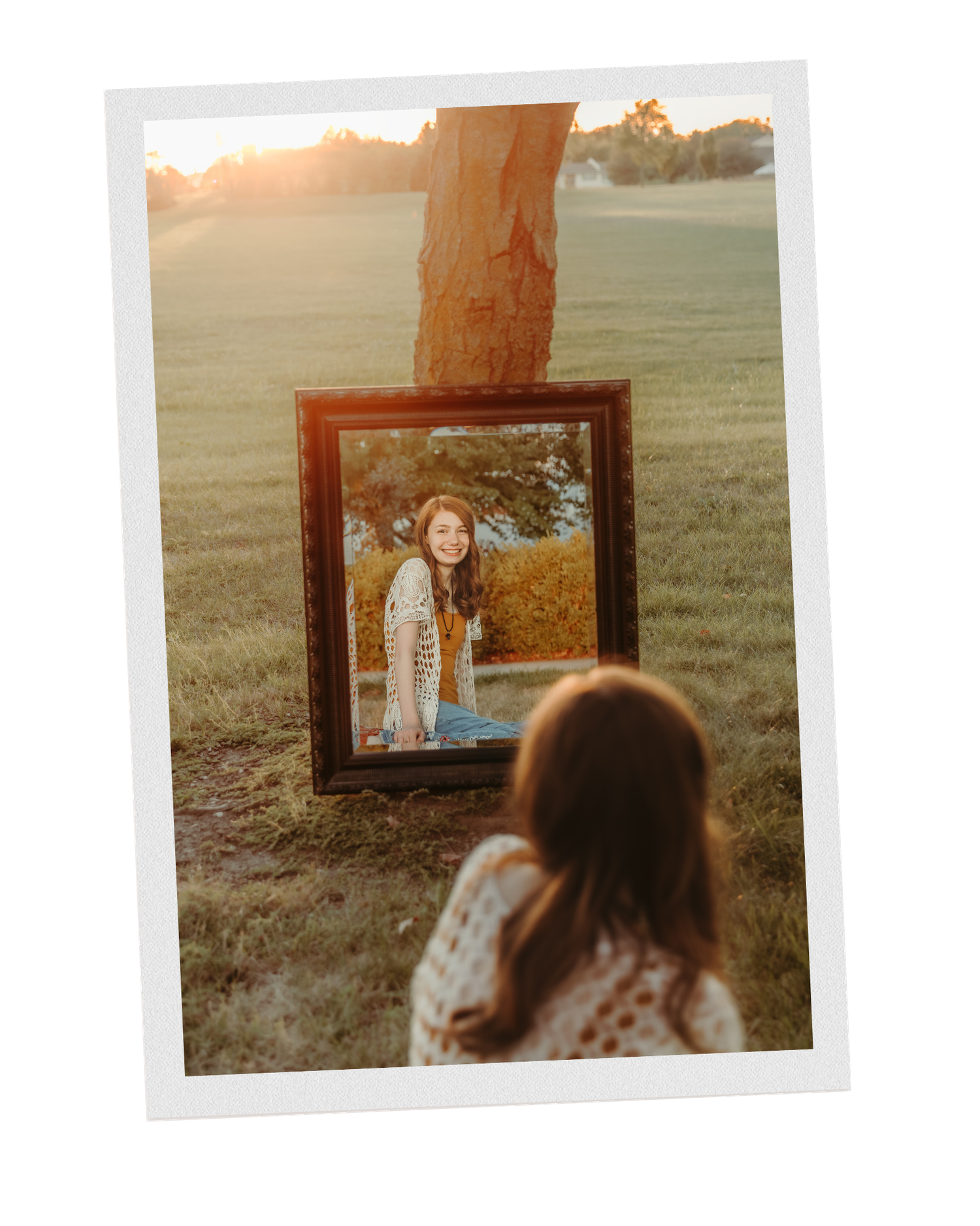 High school senior sitting in front of sunset during senior photos with Central Illinois Photographer