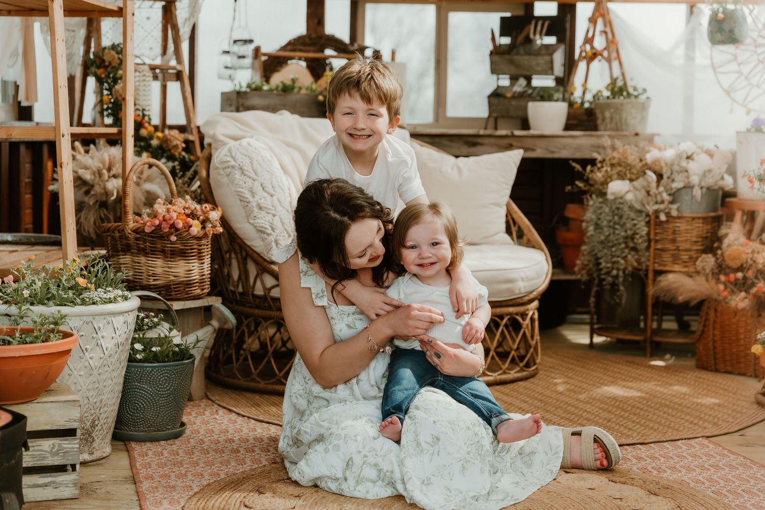 Mom cuddles in with her babies during a mothers day photo session with central il family photographer