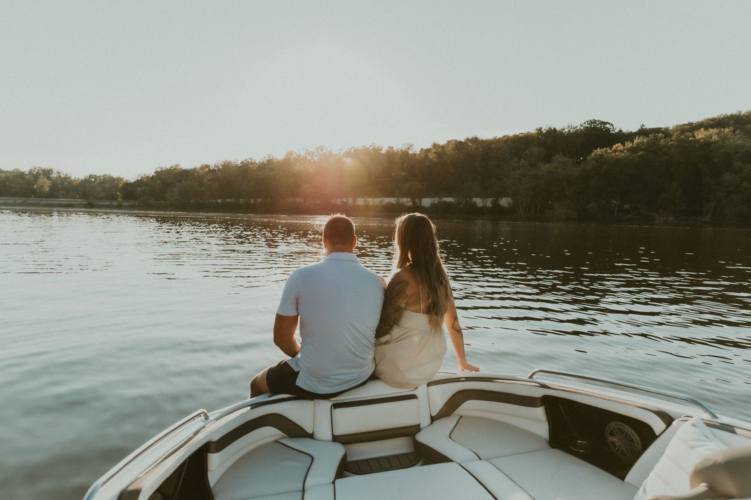 Couple shares an intimate moment during their engagement session on their boat captured by illinois wedding photographer
