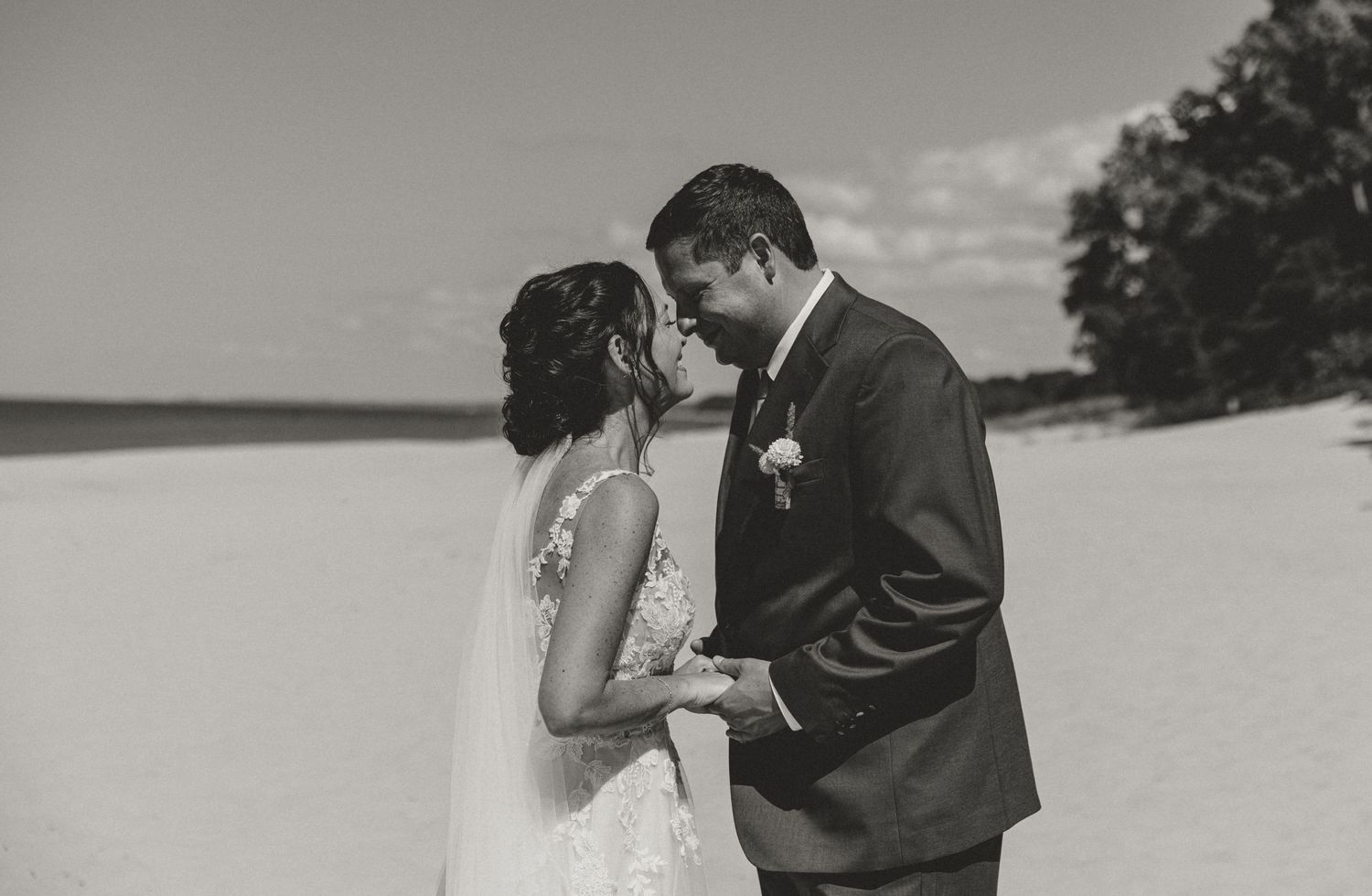 Bride and Groom share their first look and private vows at Town Line Beach in Union Pier, MI captured by michigan wedding photographer