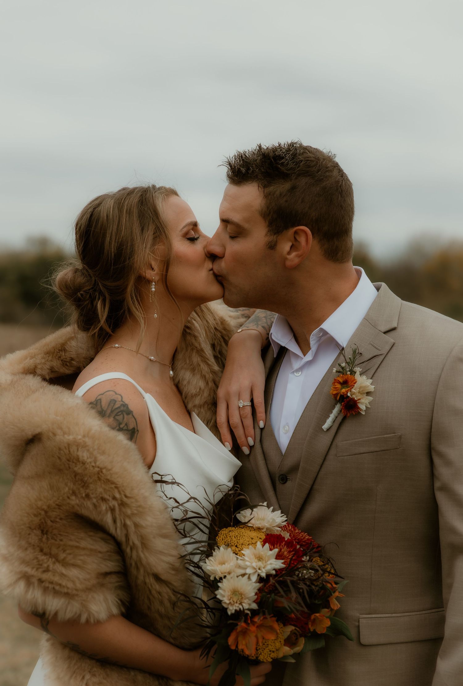 Bride and Groom share a kiss during their wedding portraits with illinois wedding photographer