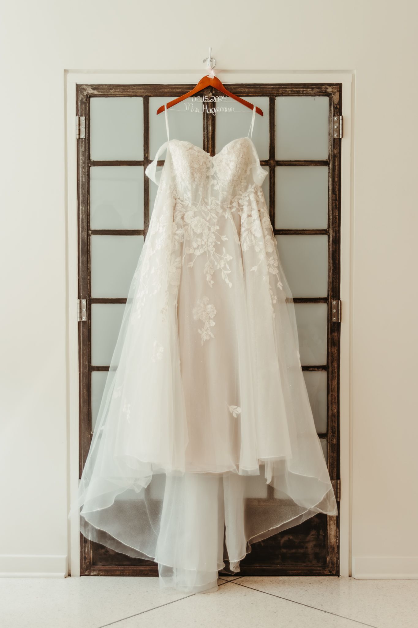 A moment for the bride's dress captured by central illinois photographer