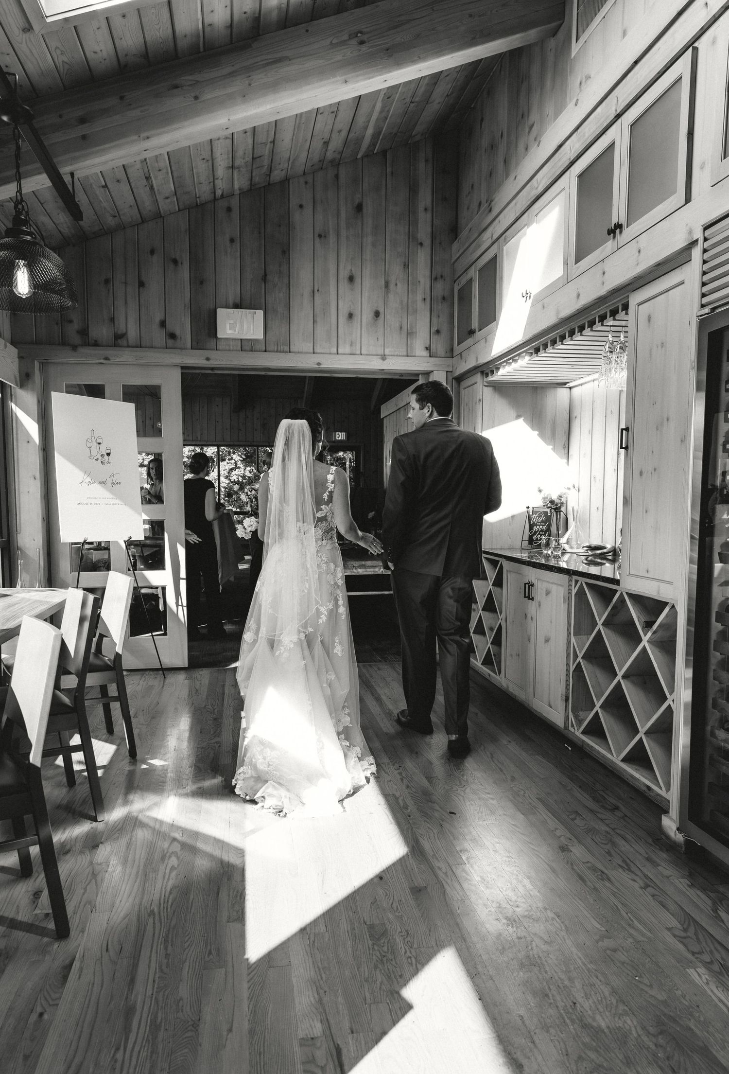 Bride and Groom walking into their wedding reception captured by michigan elopement photographer