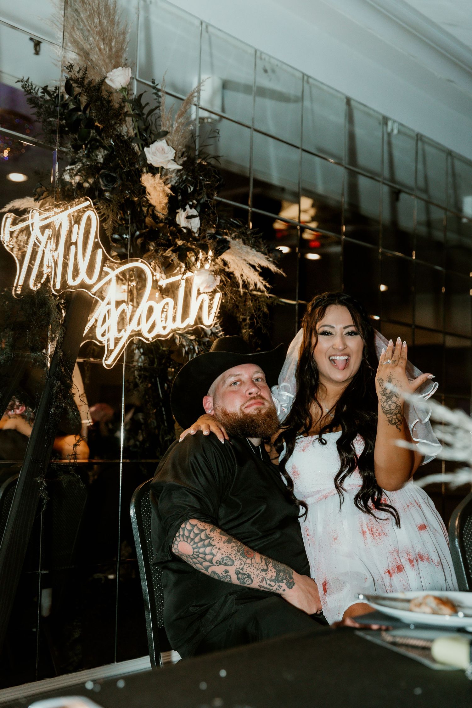 Bride and Groom at their wedding table for wedding portraits during reception