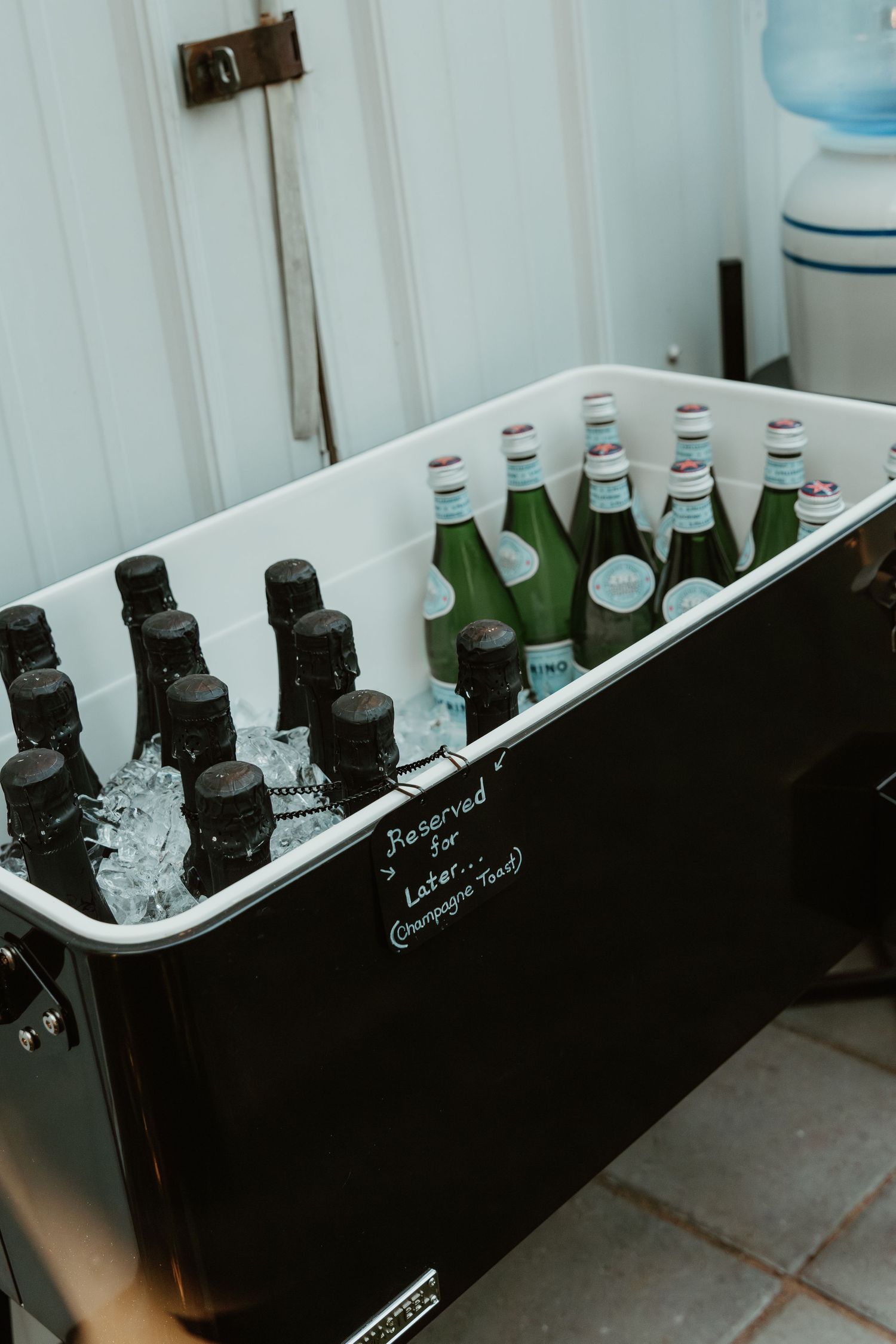 Champagne bottles elegantly displayed at a festive wedding reception, ready for celebratory toasts captured by illinois wedding photographer