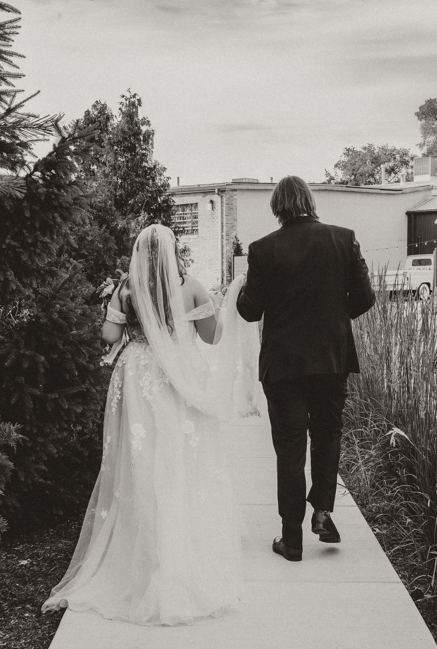 Sehl Photography IL wedding photographer captures elegant couple walking post-ceremony—graceful motion, natural light, timeless love