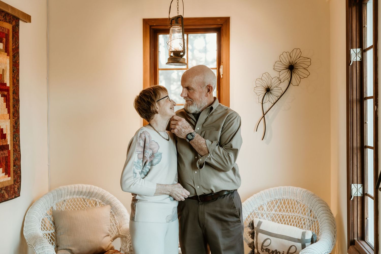 couple posing at 50th anniversary party for central illinois photographer