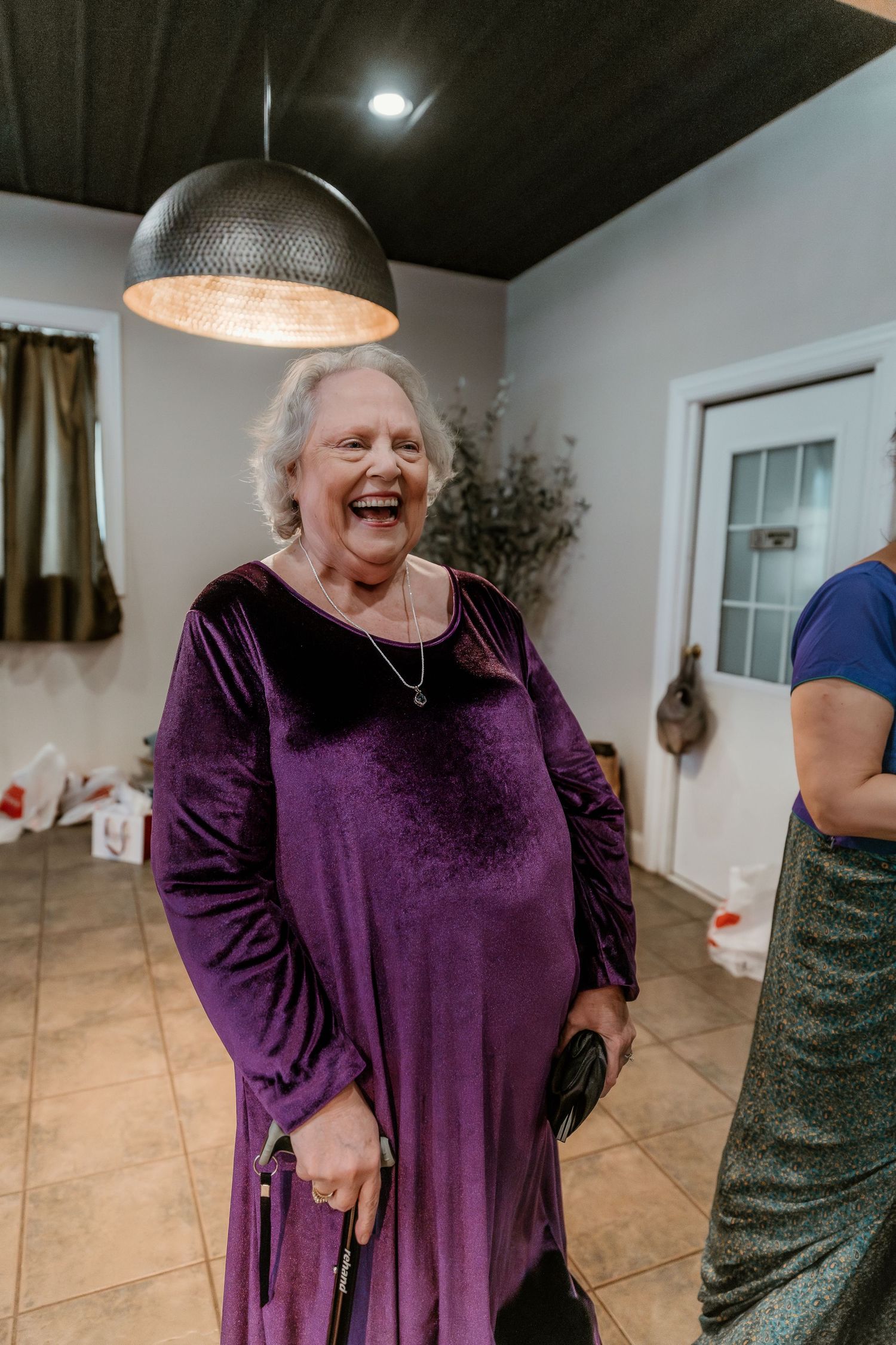 Grandmother's heartfelt first look at her granddaughter in her bridal attire, capturing a touching and emotional wedding moment