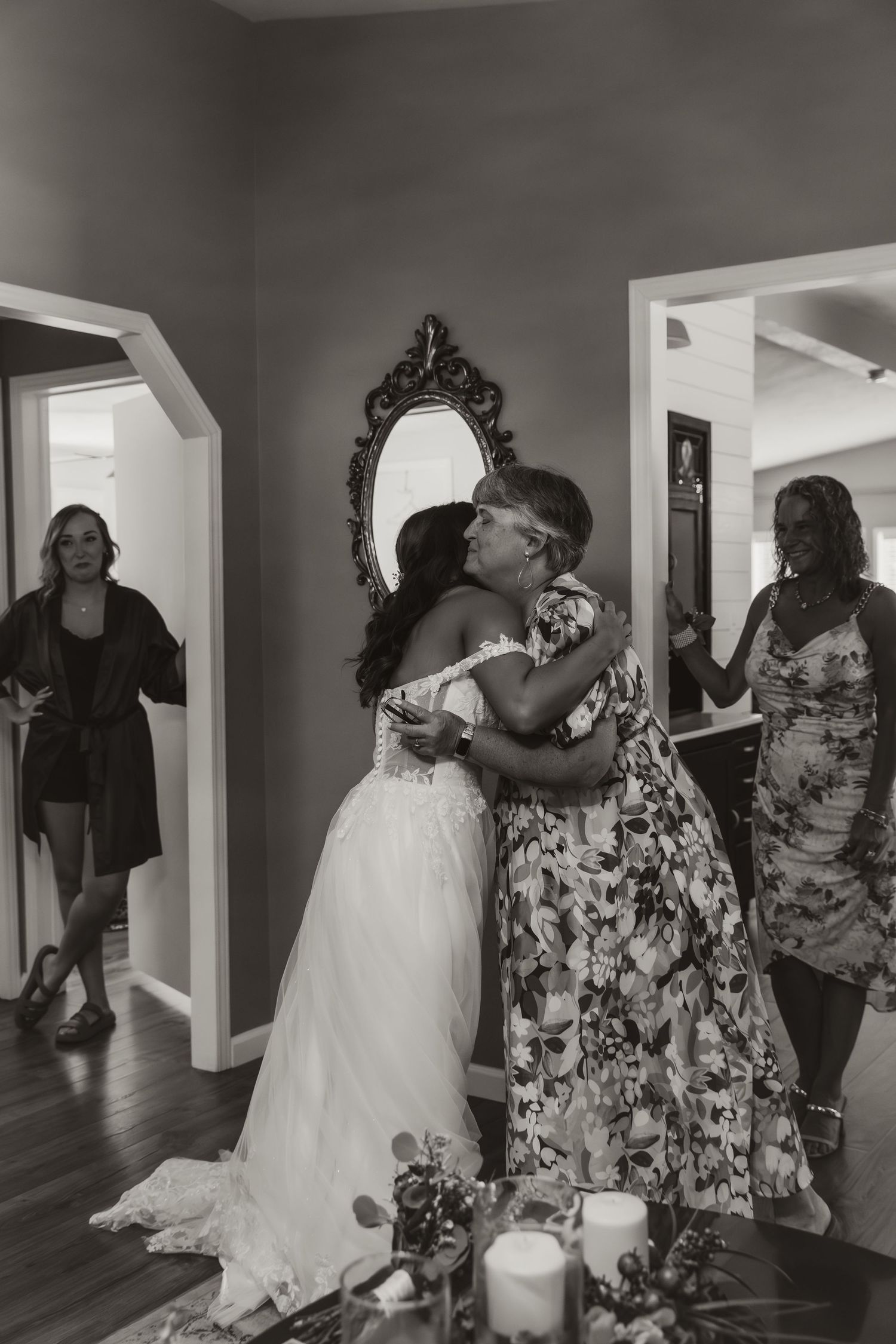 Bride and mother of bride share an emotional hug before the wedding ceremony capturing an authentic moment by central illinois wedding photo