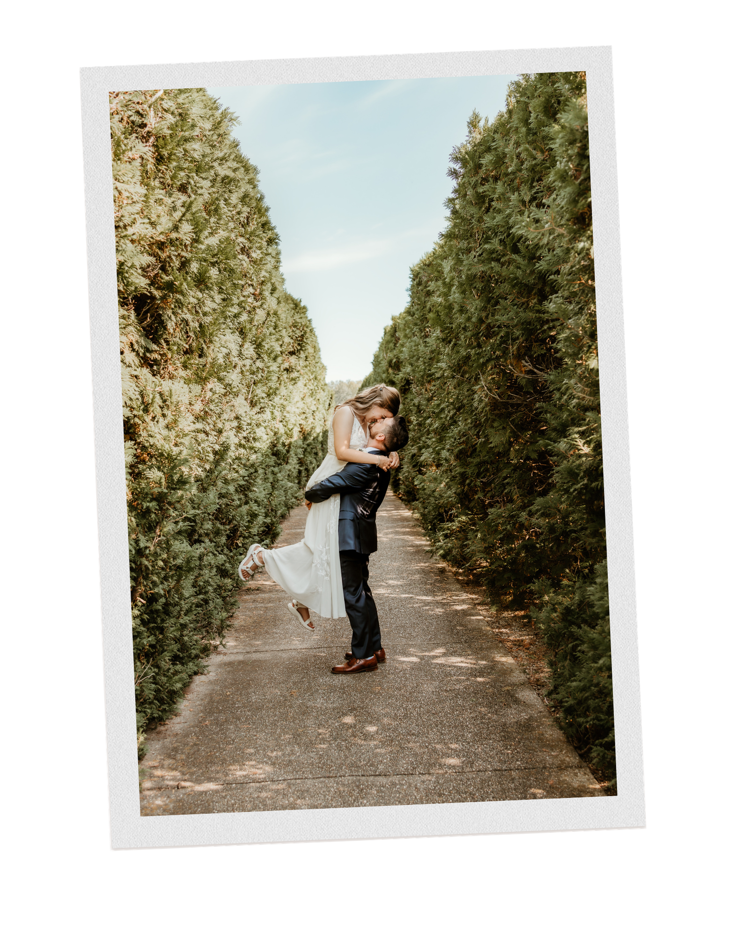 Groom lifts bride up for wedding portraits at Allerton Park, Monticello, IL with Central Illinois Photographer