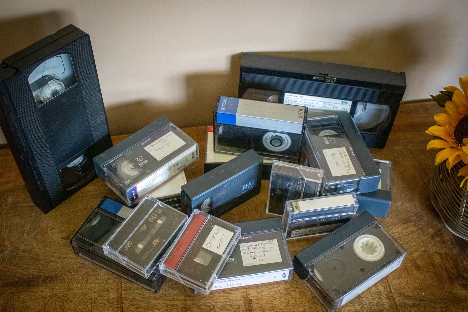 Different types of VHS and mini-VHS tapes on a table