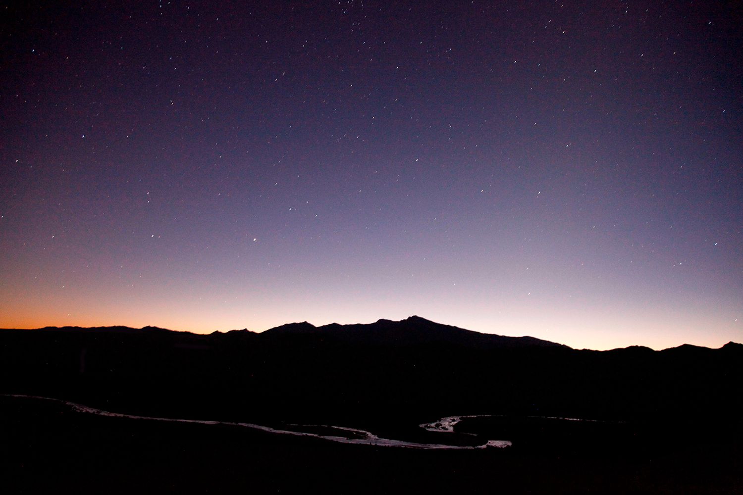 Photo of the sunset from the land art piece Double Negative.