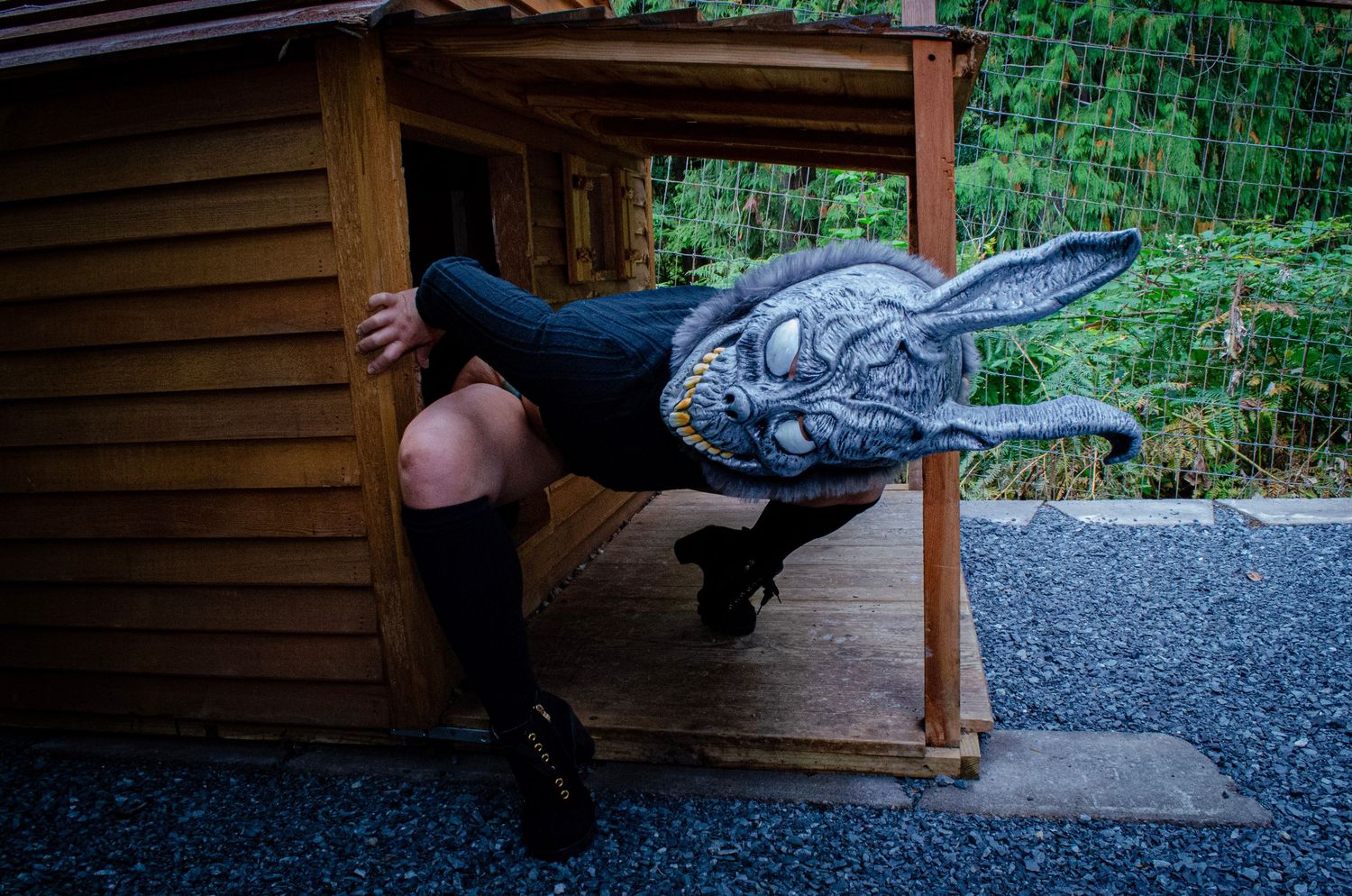 Outdoor dark photoshoot. Donnie Darko theme in a animal house/forest.