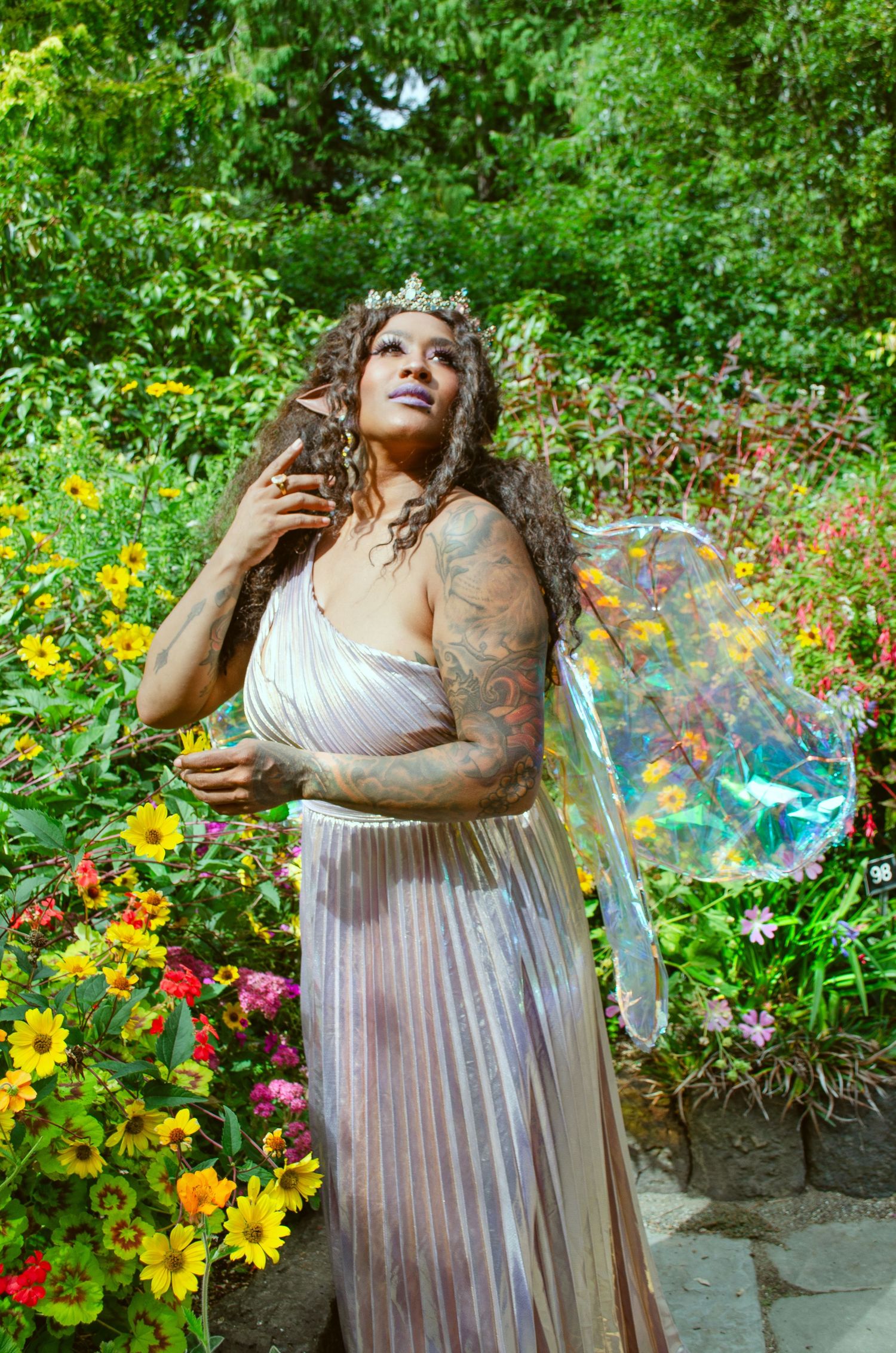 A photo of the fairy queen enjoying her garden in the sun.