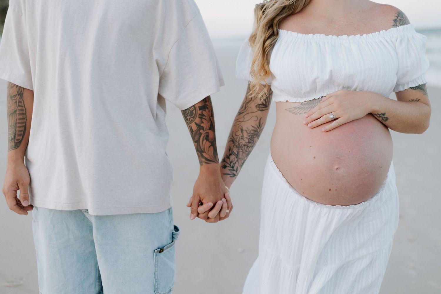 A collage of pregnancy photos showing a pregnant belly in white clothing against a light background.