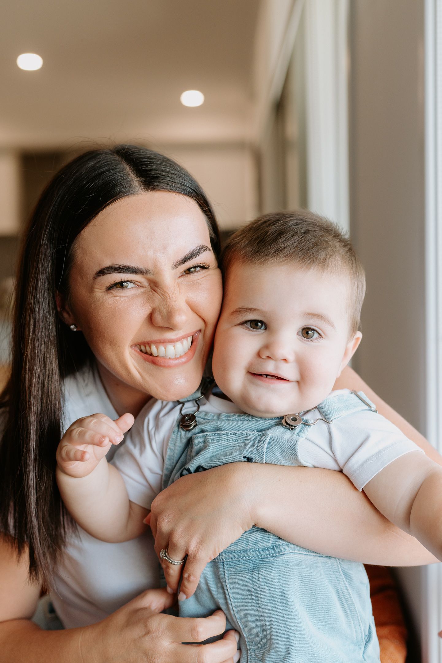 A joyful moment captured in a series of candid photos showing affectionate embraces and genuine smiles.