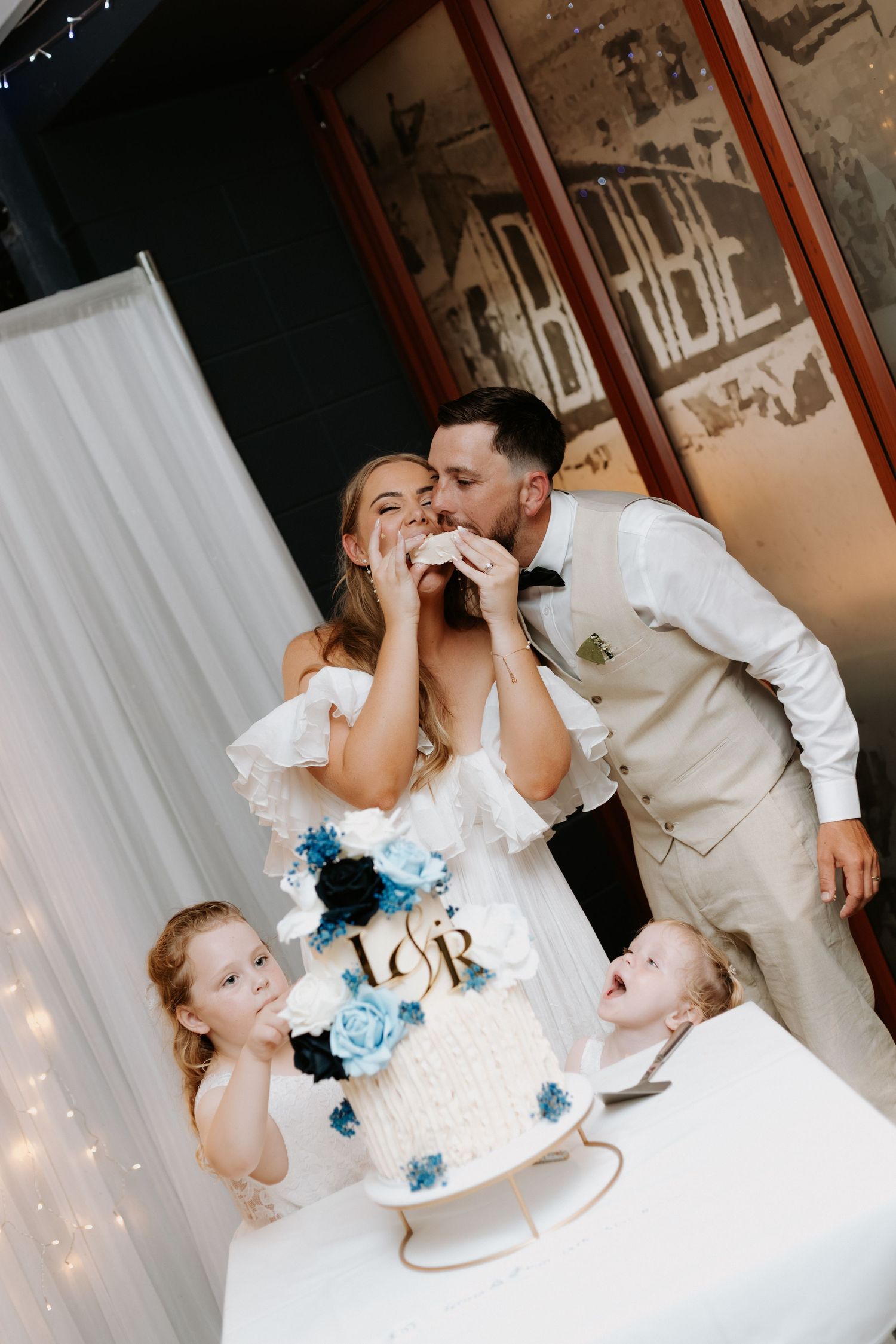 A romantic wedding cake cutting sequence shows the couple sharing sweet moments at their reception.