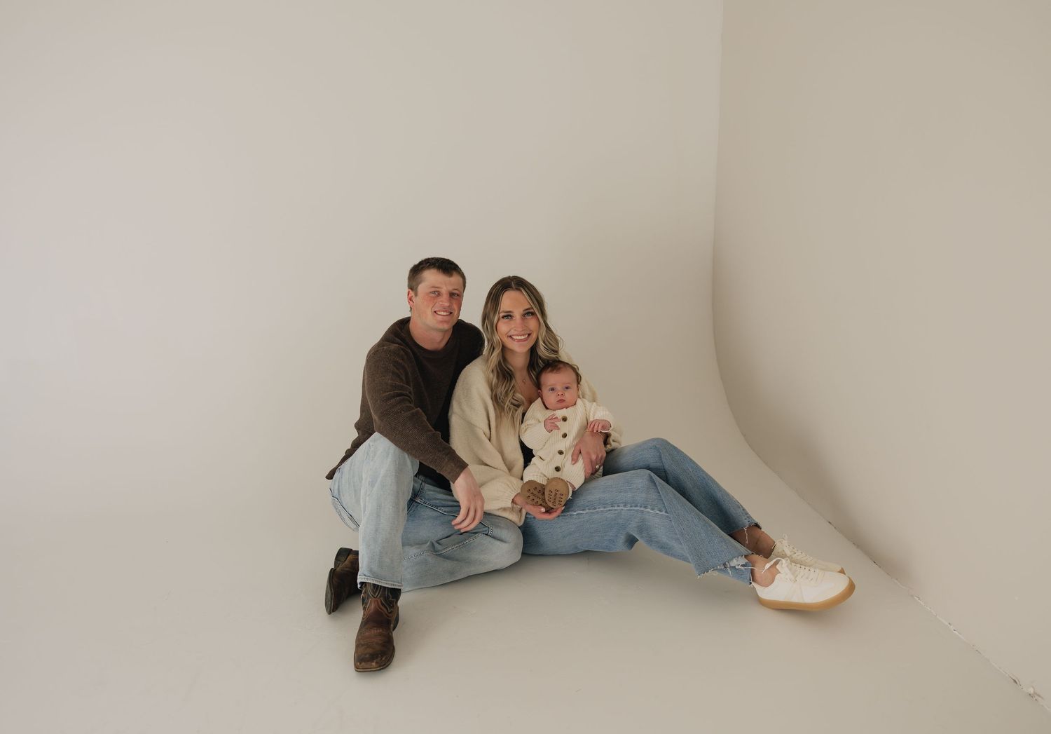 North Dakota family session in a studio wearing neutrals.