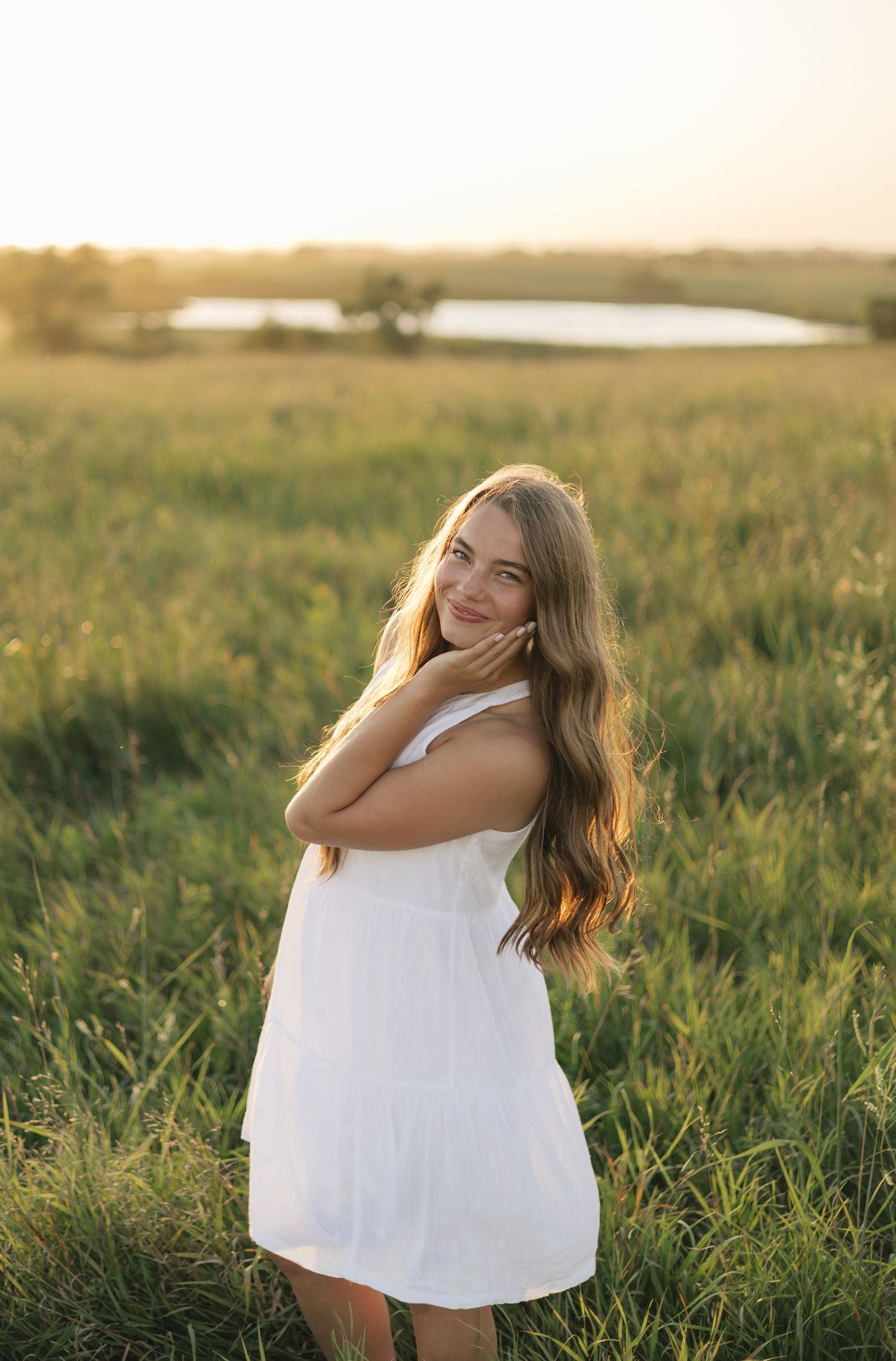 Minnesota senior session during sunset in a grass field.