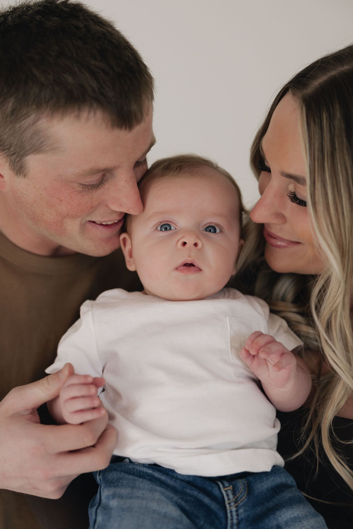 North Dakota family session in a studio wearing neutrals.