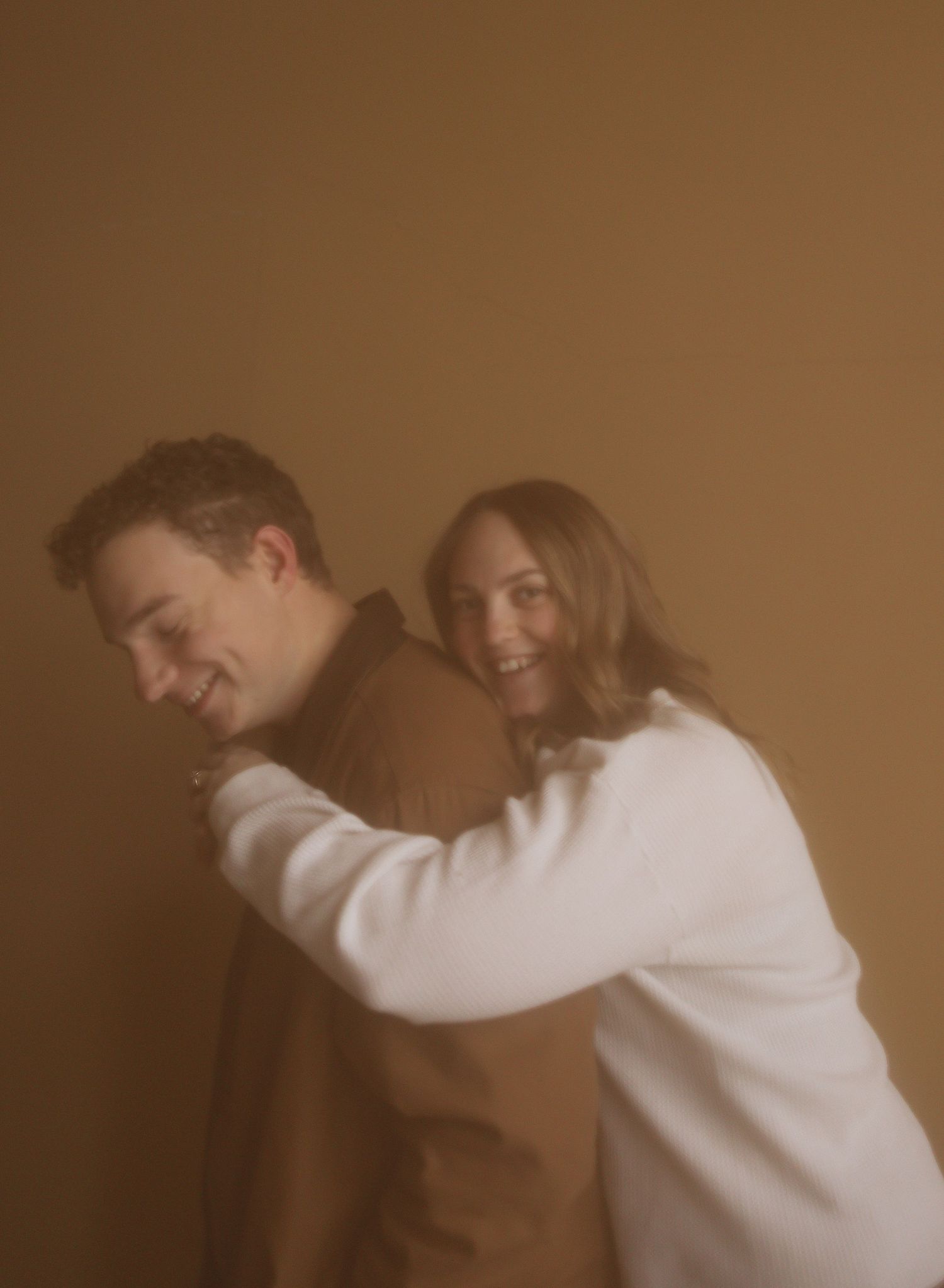 North Dakota engagement session in a studio wearing neutrals.