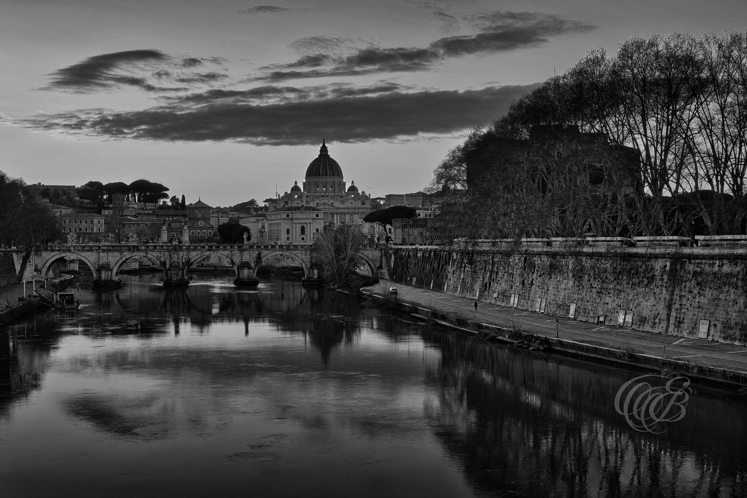 Italy – Ponte Sant’Angelo at sunset with St. Peter’s Basilica - Rome – black and white photo of the bridge and Vatican dome, by Eduardo Bart