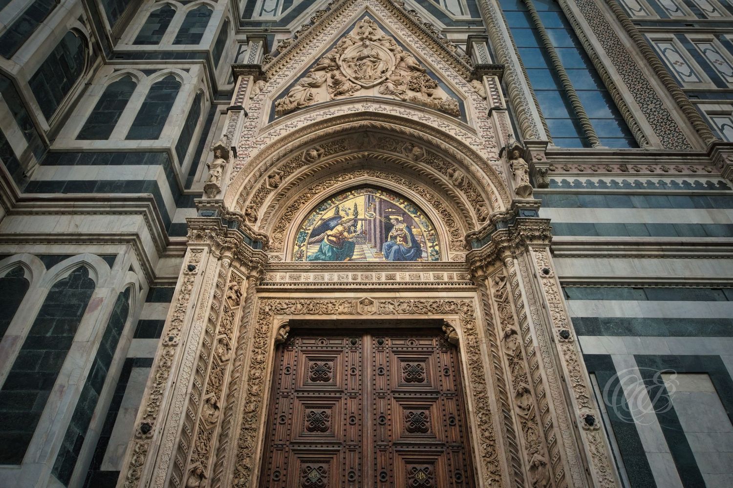 Italy – Santa Maria del Fiore entrance - Florence – view of the cathedral marble doorway, photo by Eduardo Bartoli