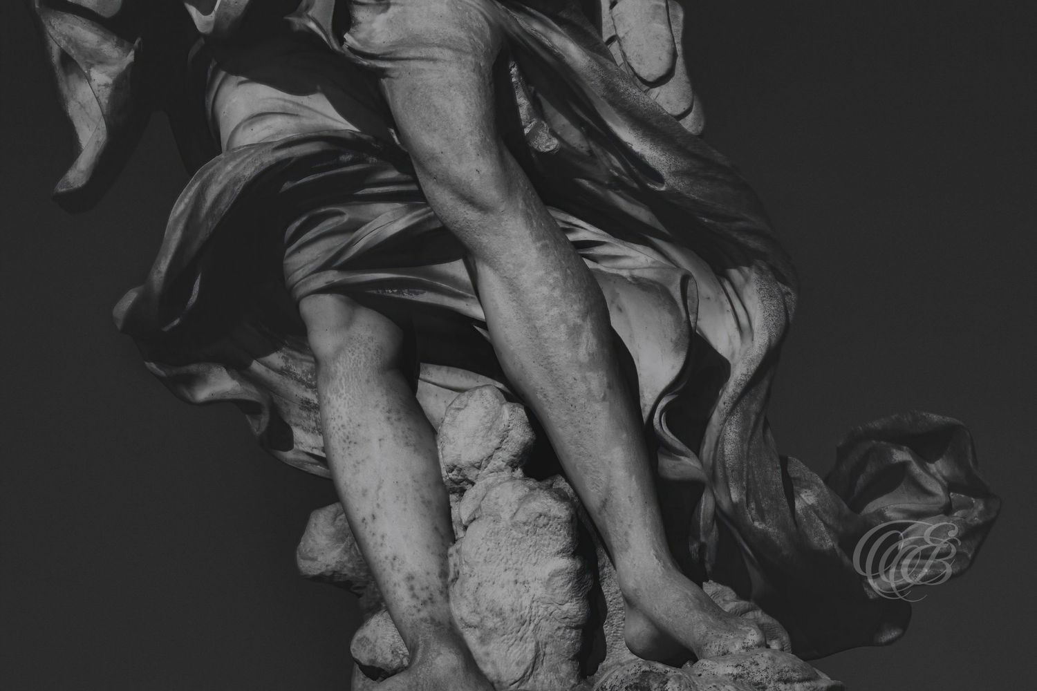 Italy – angel feet on Ponte Sant’Angelo - Rome – black and white photo of baroque sculpture detail, by Eduardo Bartoli