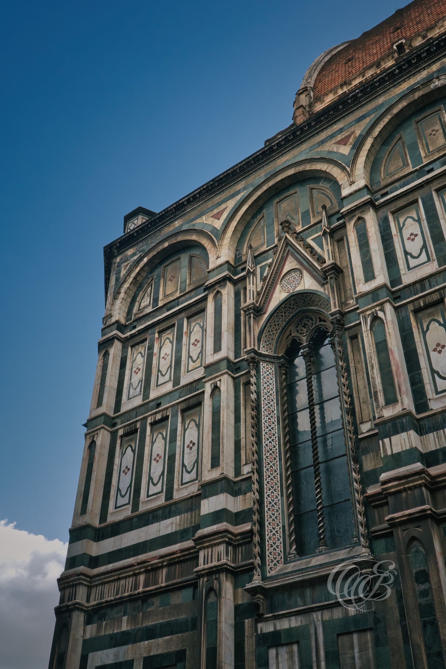 Italy – Santa Maria del Fiore side façade - Florence – view of the cathedral marble architecture, photo by Eduardo Bartoli