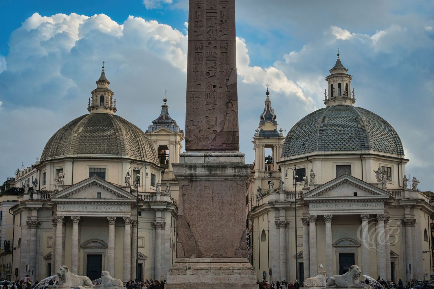Italy – Fountain of the Lions - Piazza del Popolo Rome – stone lions fountain at the base of the obelisk, photograph by Eduardo Bartoli
