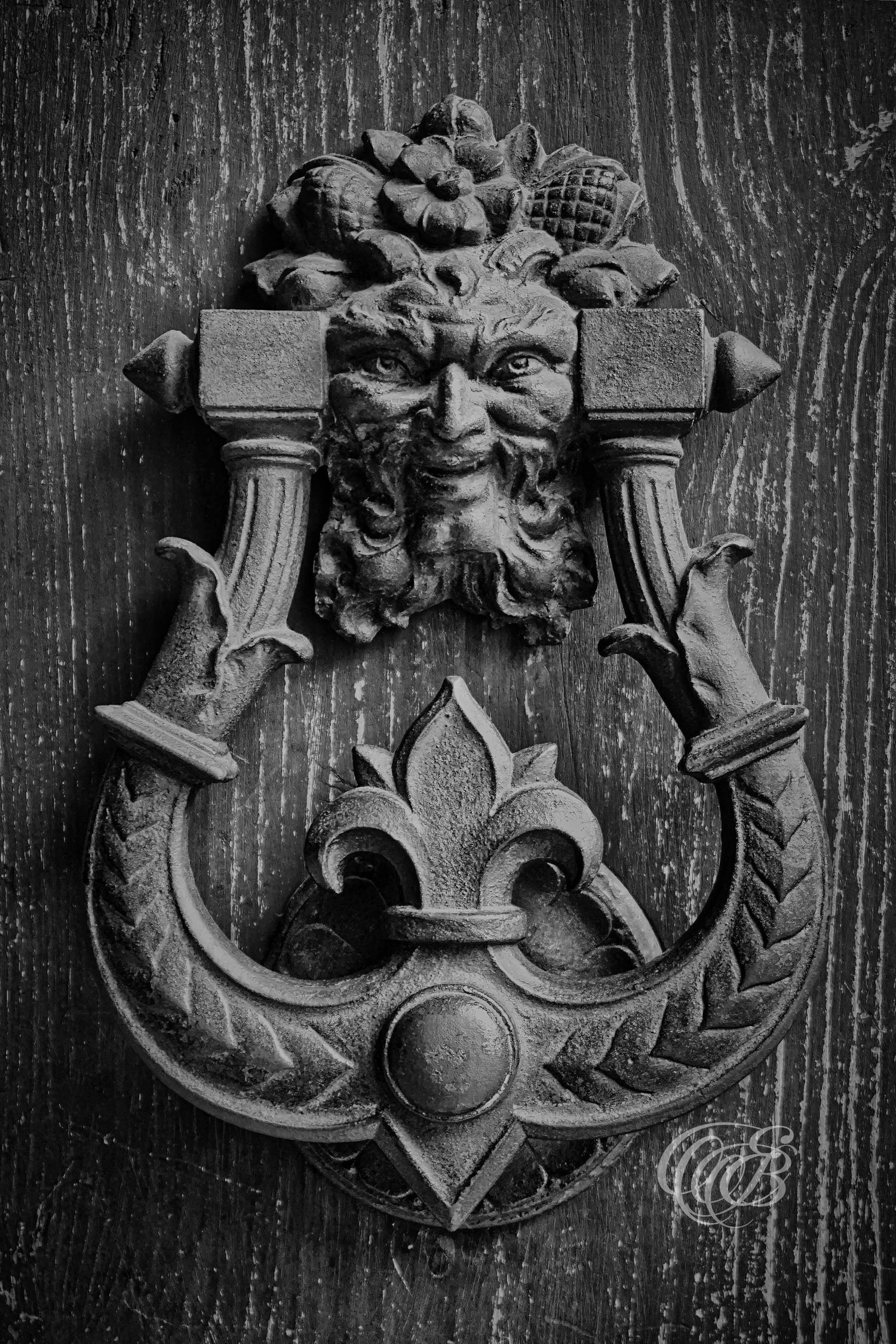 Italy – antique door knocker - Florence – black and white photo of a historic metal door detail, by Eduardo Bartoli