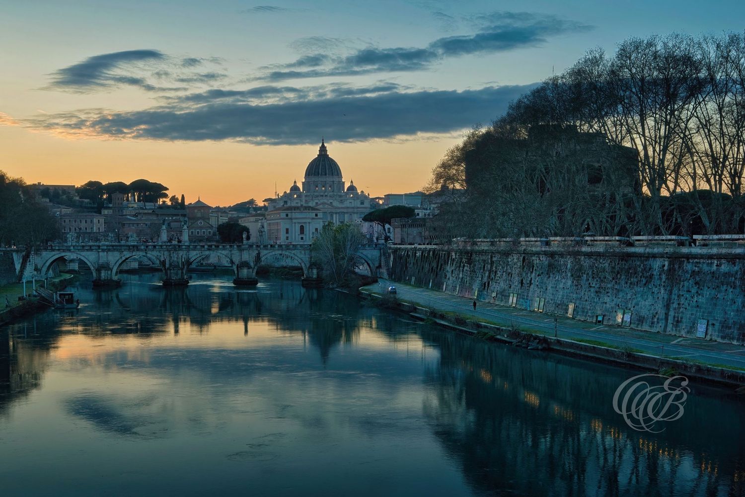 Italy – Ponte Sant’Angelo and St. Peter’s Basilica - Rome – historic bridge and Vatican dome over the Tiber, photograph by Eduardo Bartoli