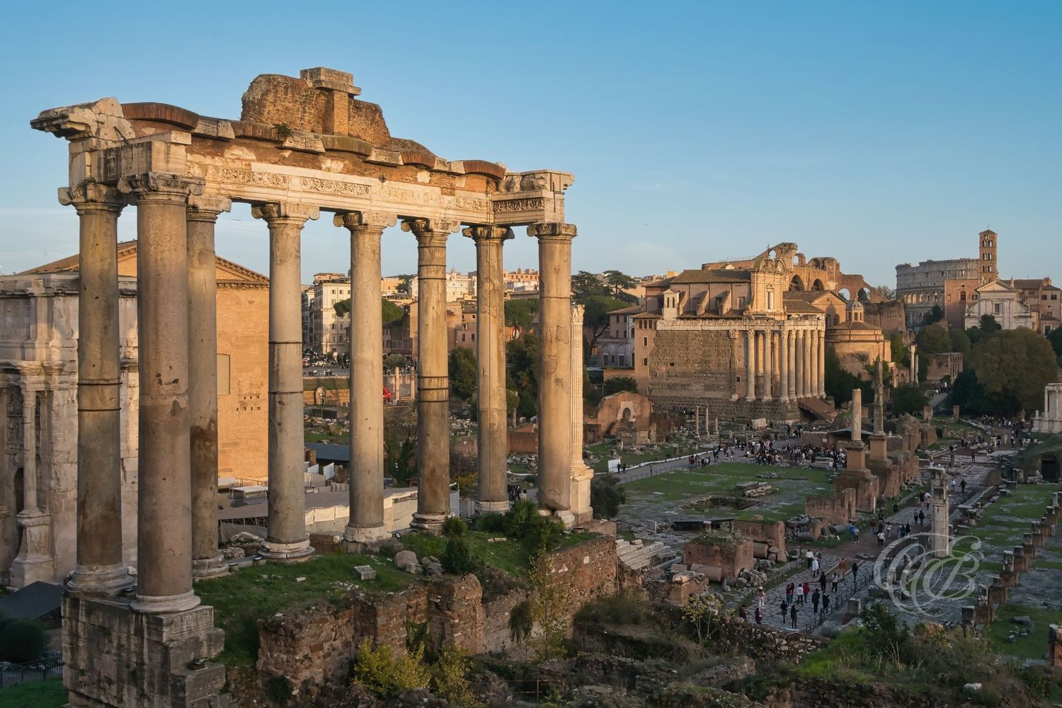 Italy – Temple of Saturn and Roman Forum - Rome – ancient temple columns rising above the historic forum ruins, photo by Eduardo Bartoli
