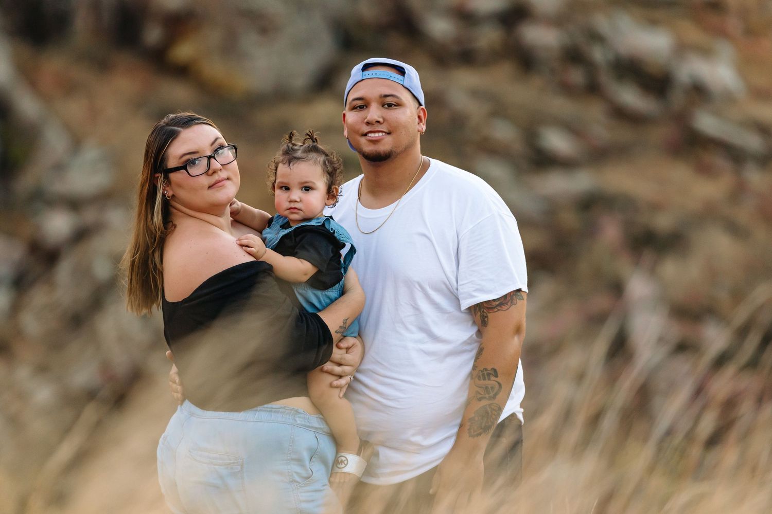 A family enjoying a peaceful moment together by a scenic lake.