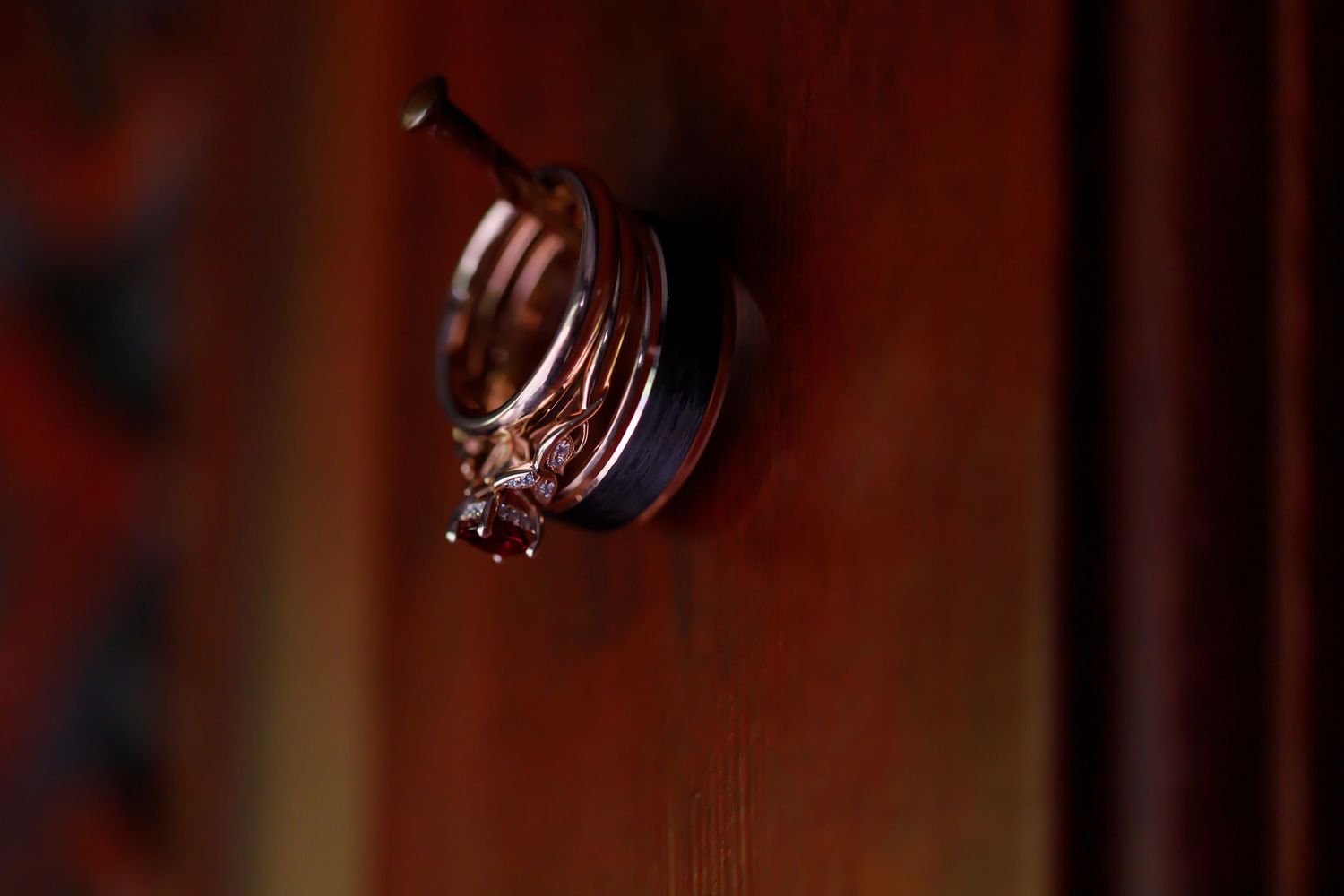 Dark atmospheric photo of hanging glass decorations in warm lighting.