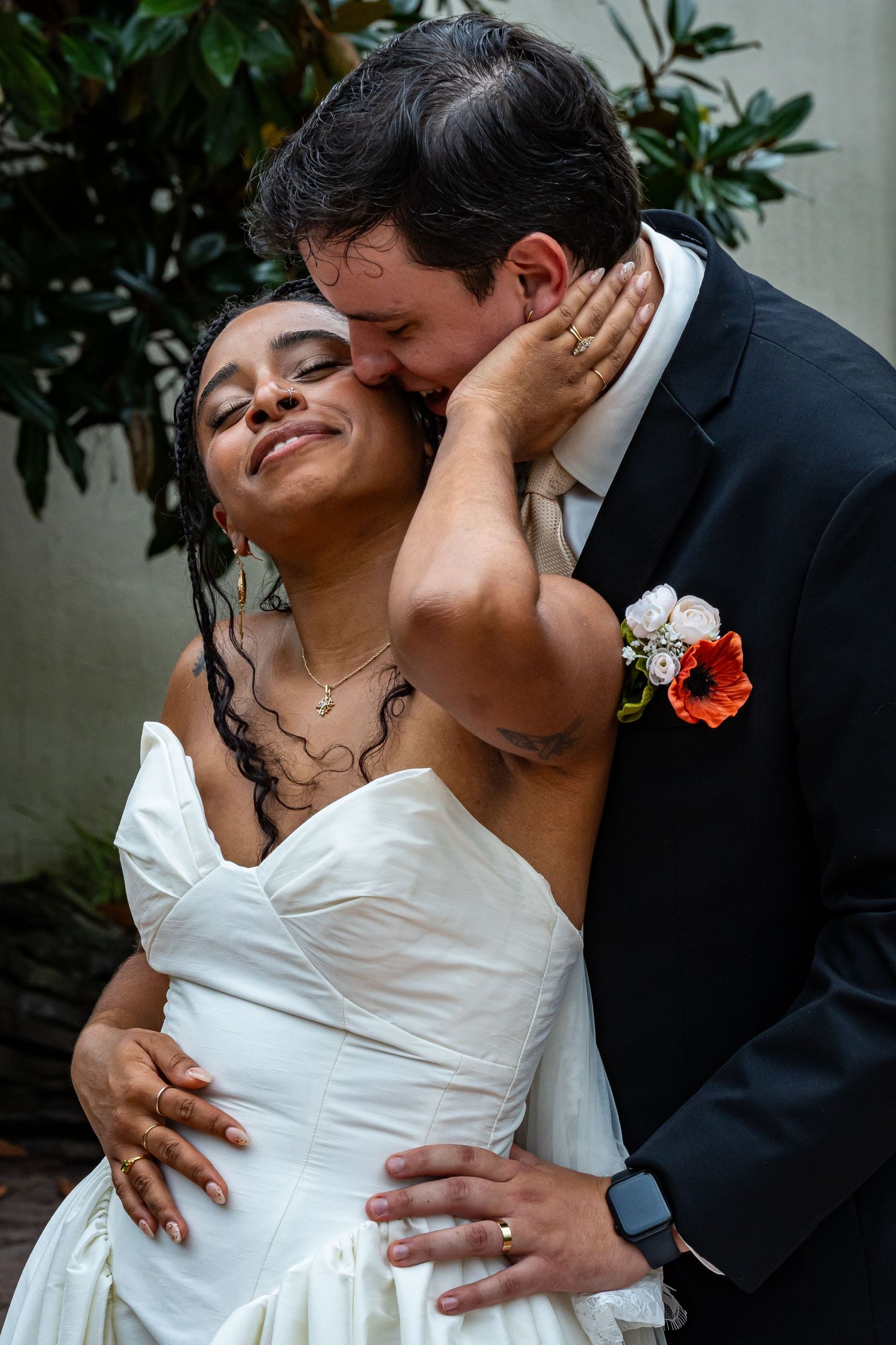 Intimate wedding portrait showing tender embrace between newlyweds.