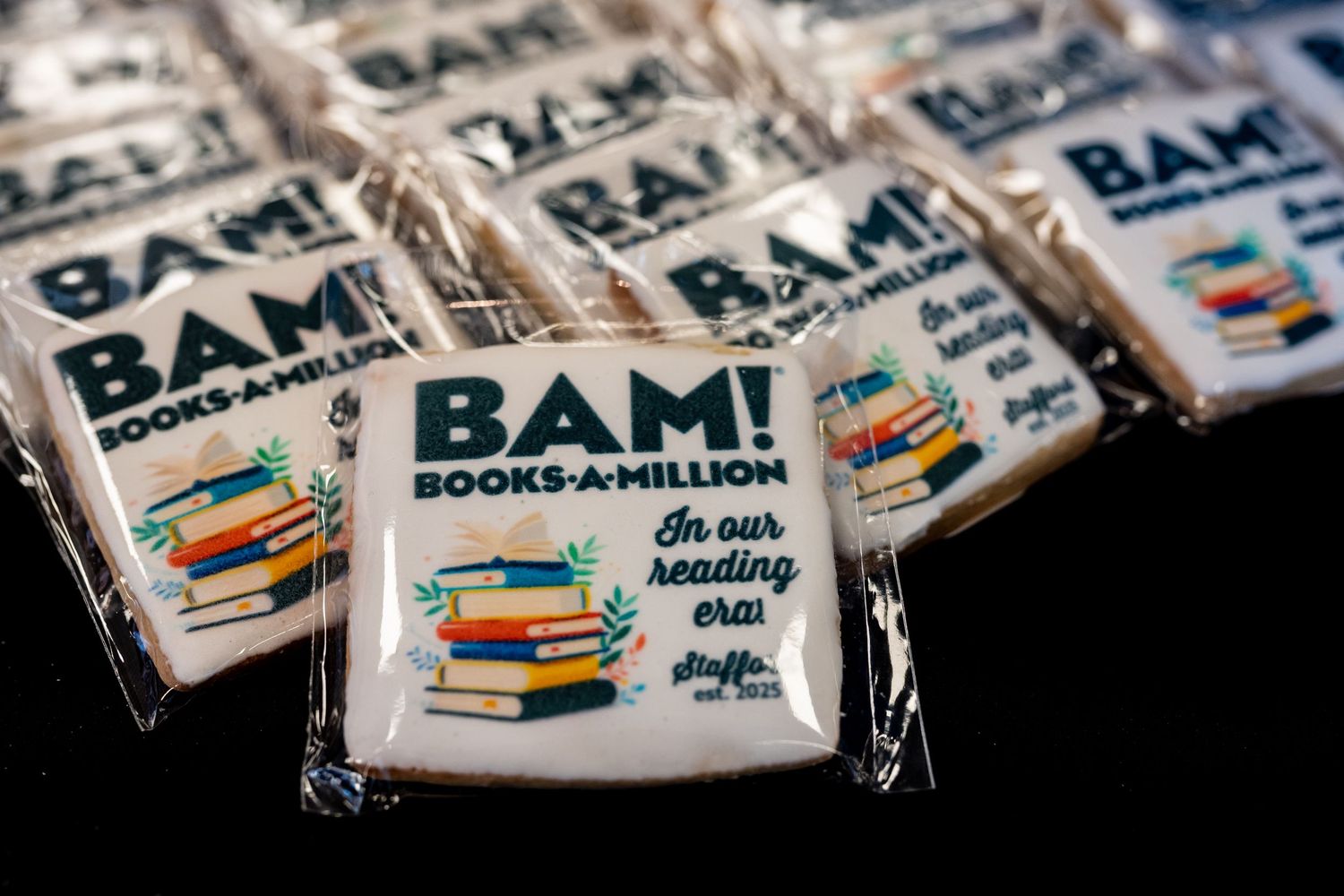 Wrapped promotional candy bars with BAM! Books-A-Million branding featuring stacked books design.