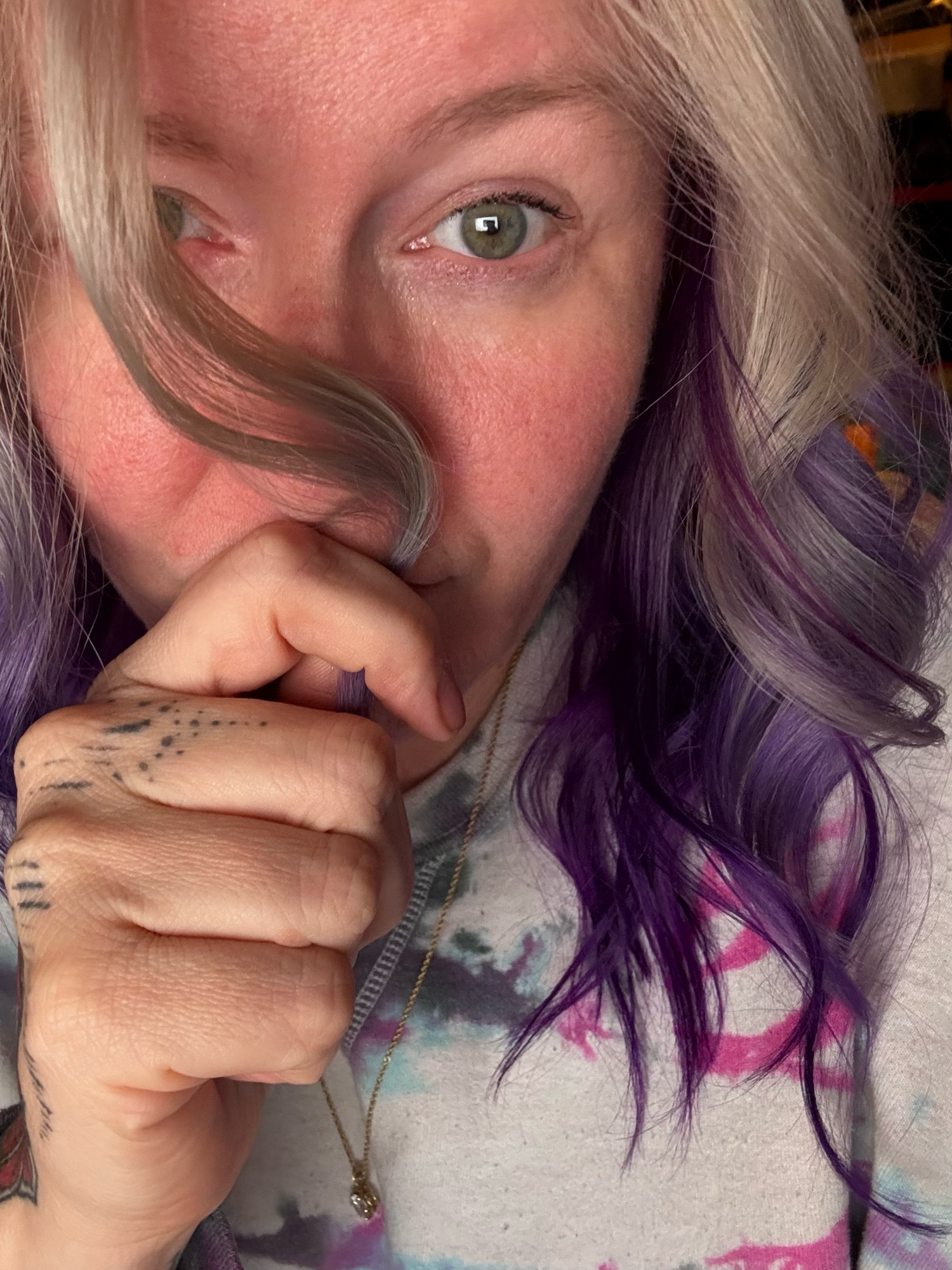 Close-up portrait series showing playful expressions and purple hair.