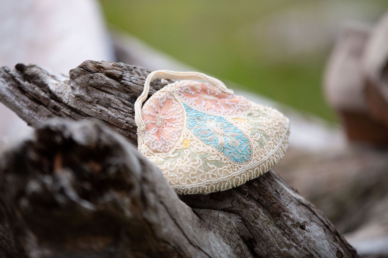 Wedding shoes placed artistically on weathered wooden surface.